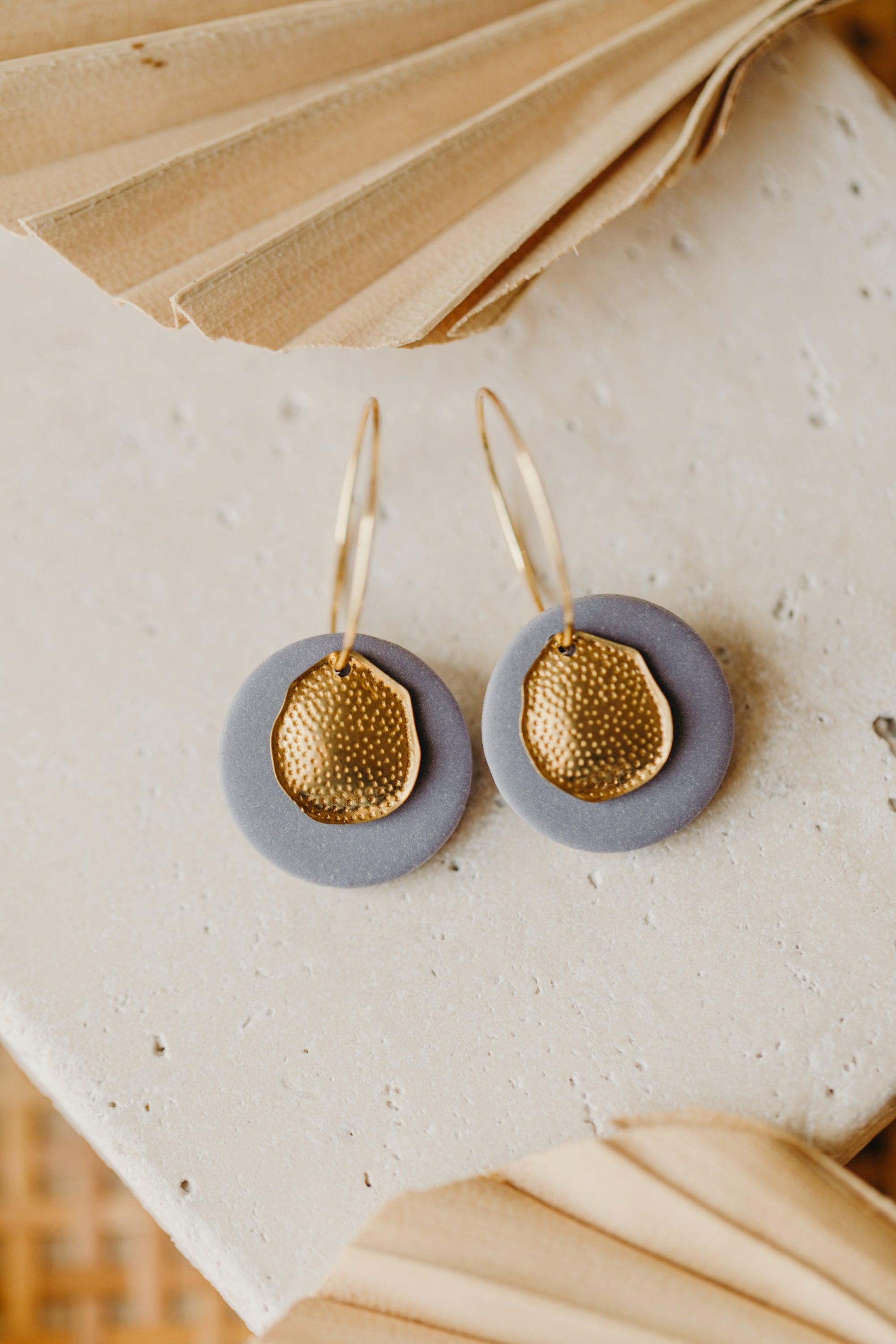 Hoop earrings with round polymer clay pendant and leaf