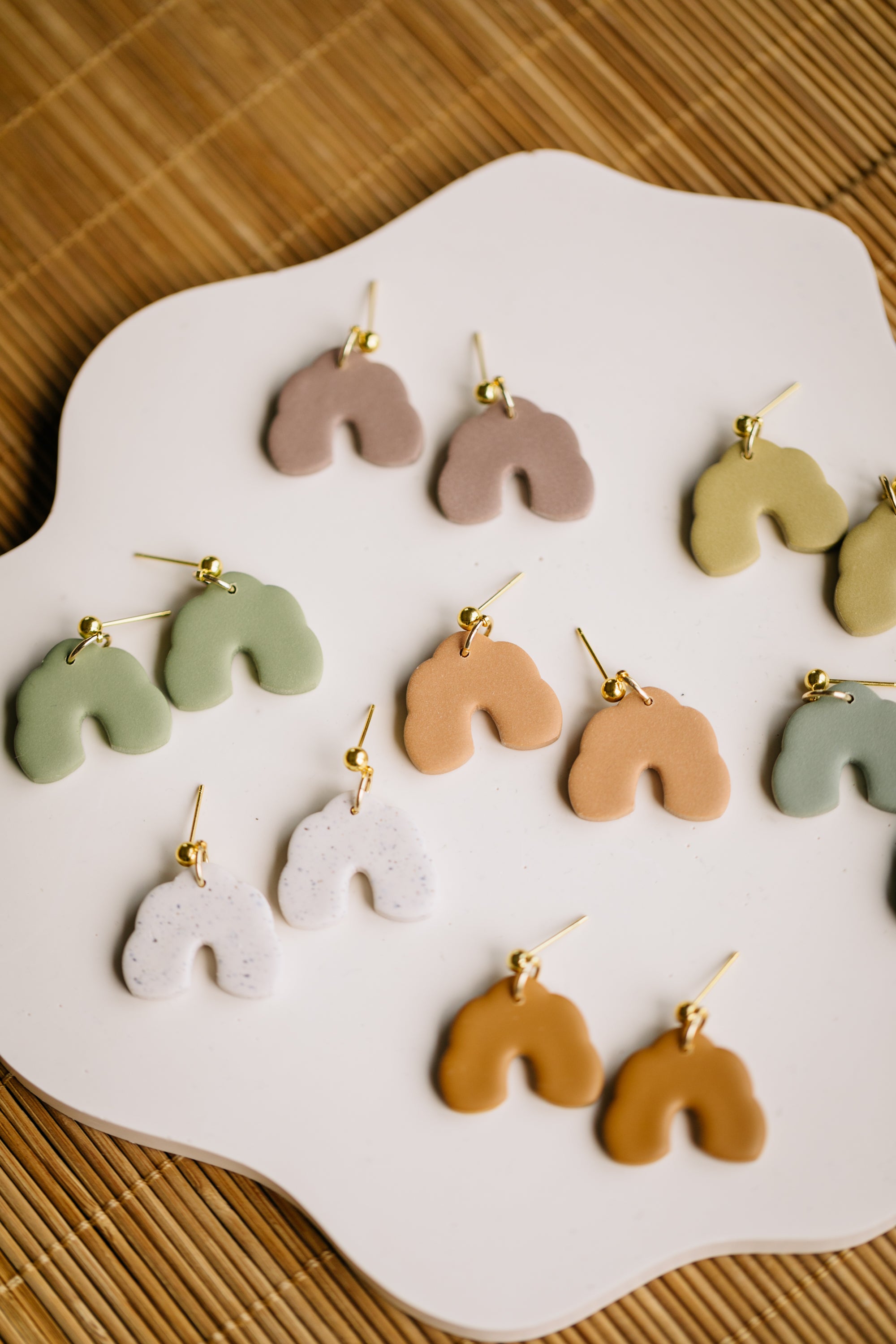 golden earrings with acrylic in white, petrol and brown