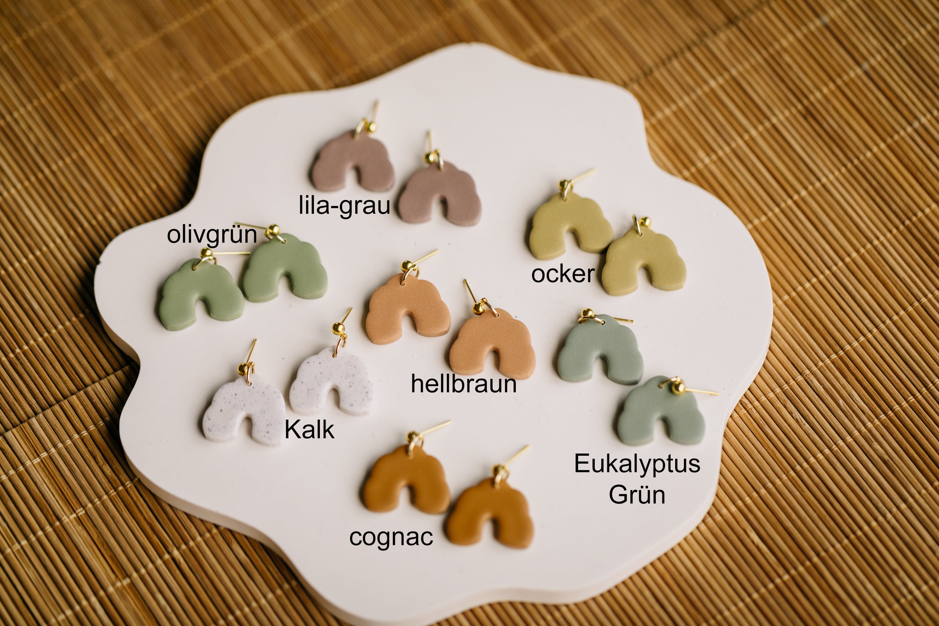 golden earrings with acrylic in white, petrol and brown