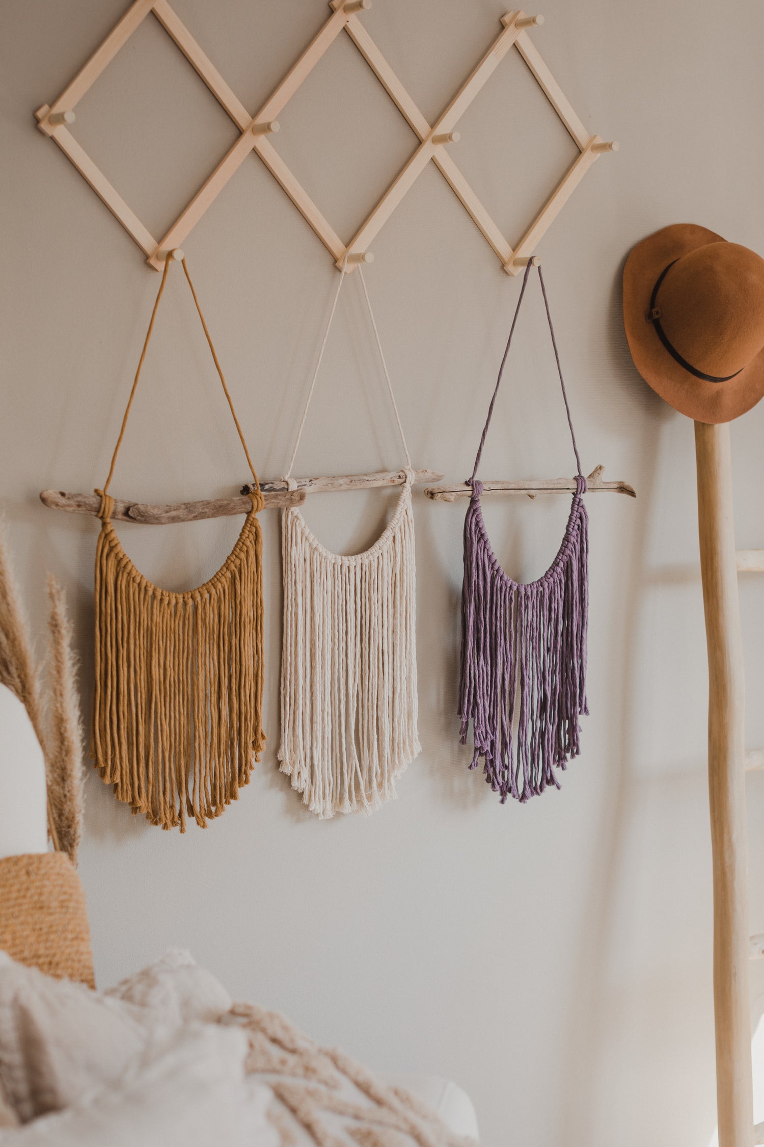 Macrame wall hanging in natural, yellow and purple colors