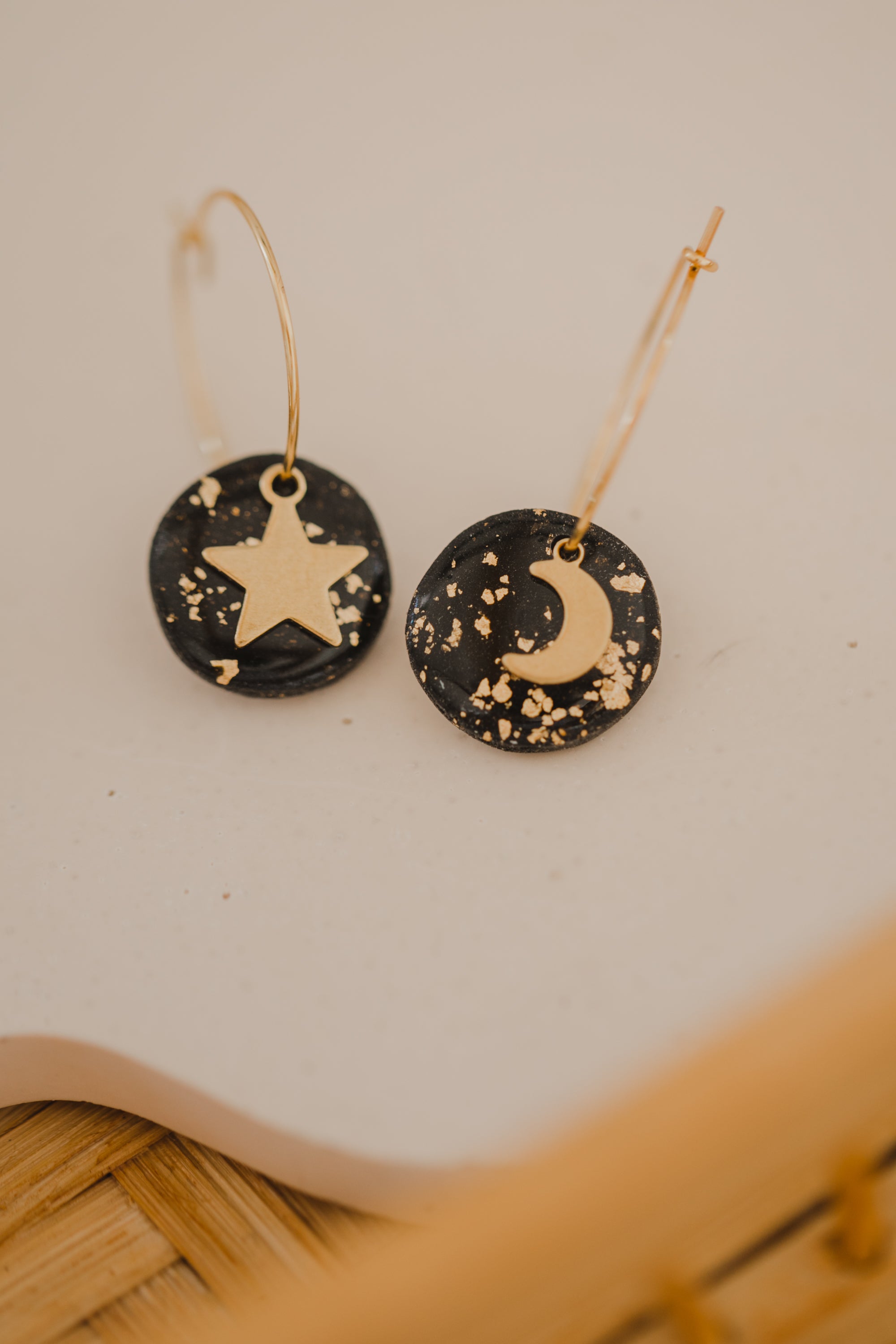 Hoop earrings with round polymer clay pendant and leaf