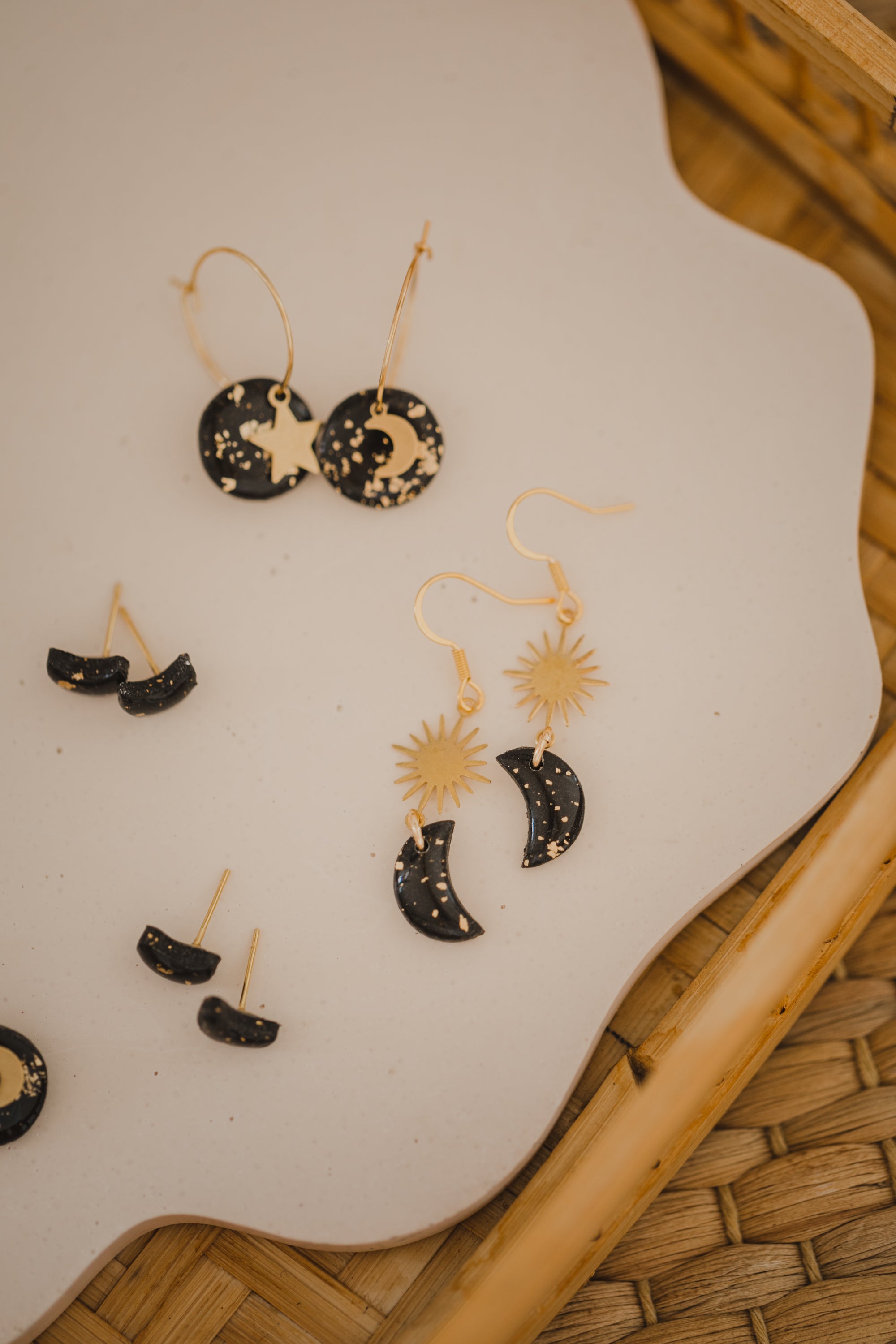 Hoop earrings with round polymer clay pendant and leaf