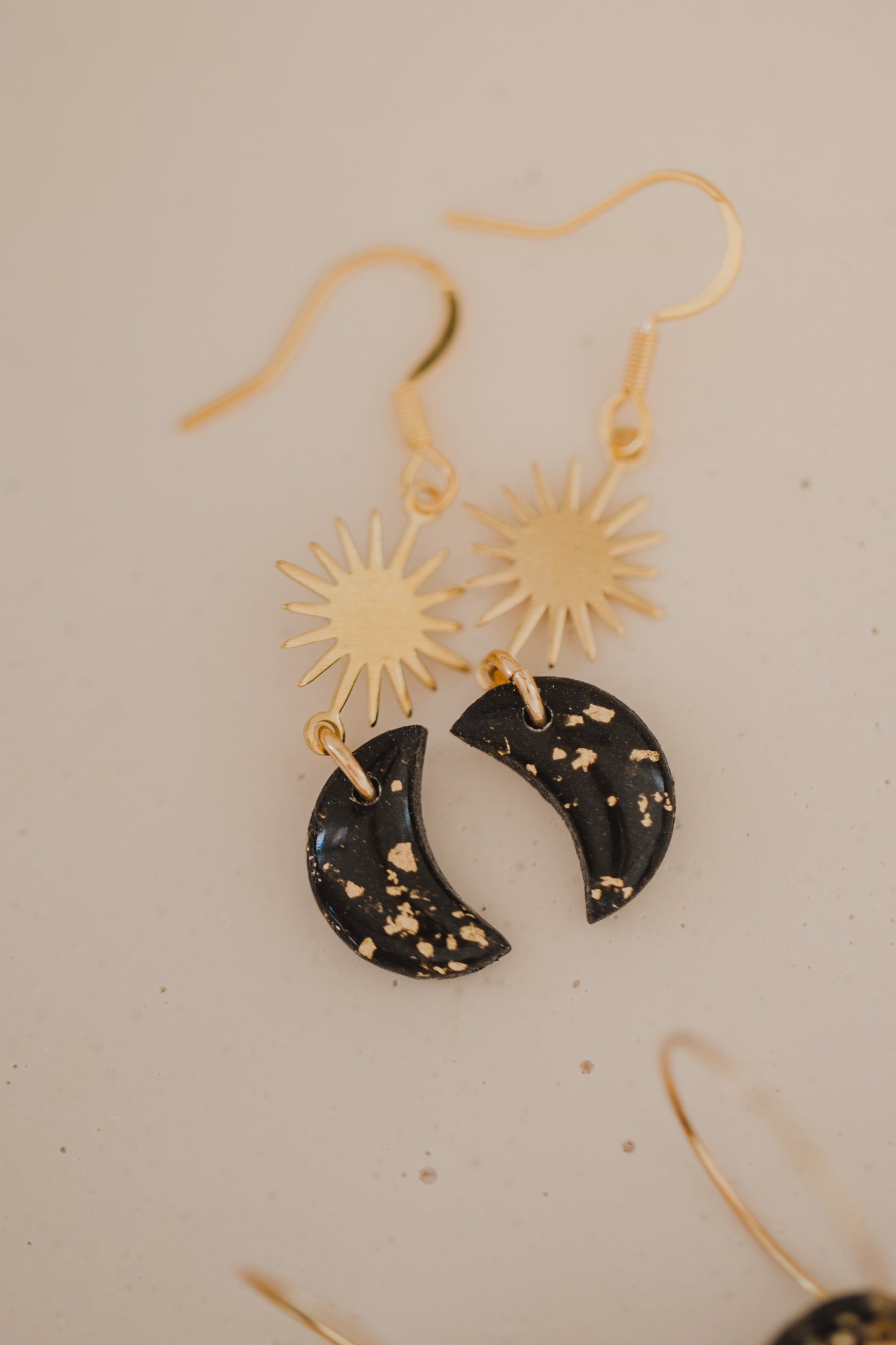 Hoop earrings with round polymer clay pendant and leaf