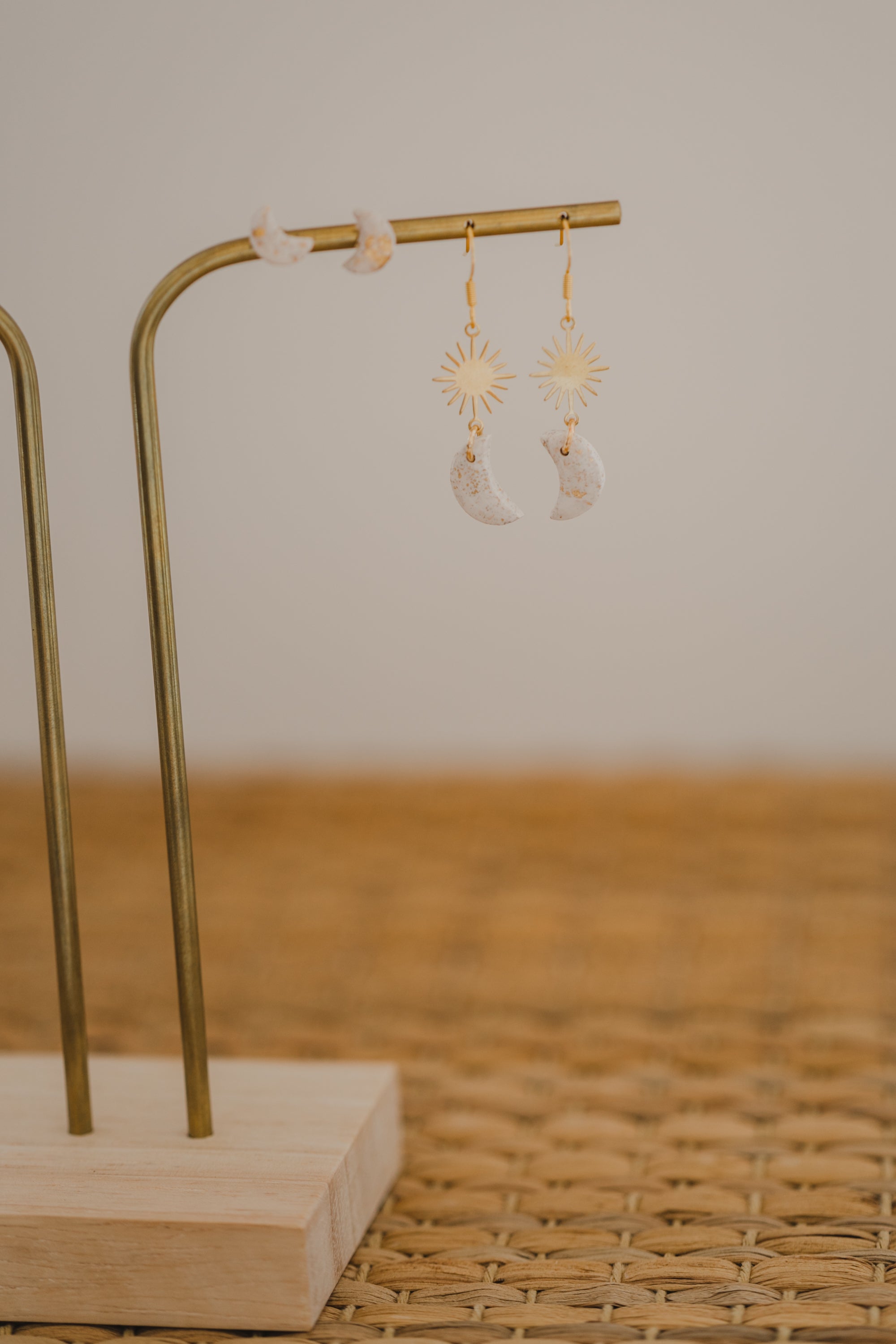 Hoop earrings with round polymer clay pendant and leaf