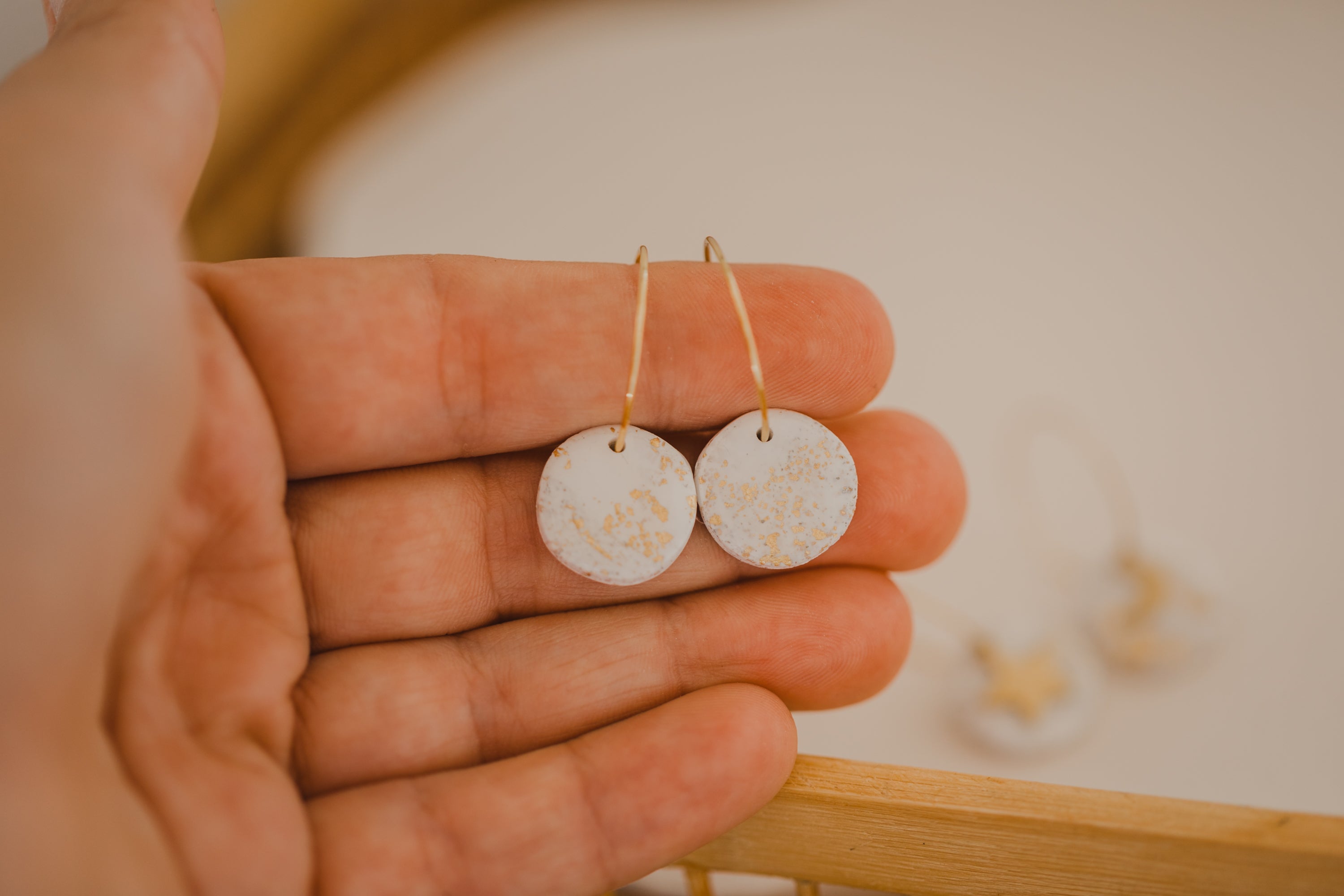 Hoop earrings with round polymer clay pendant and leaf