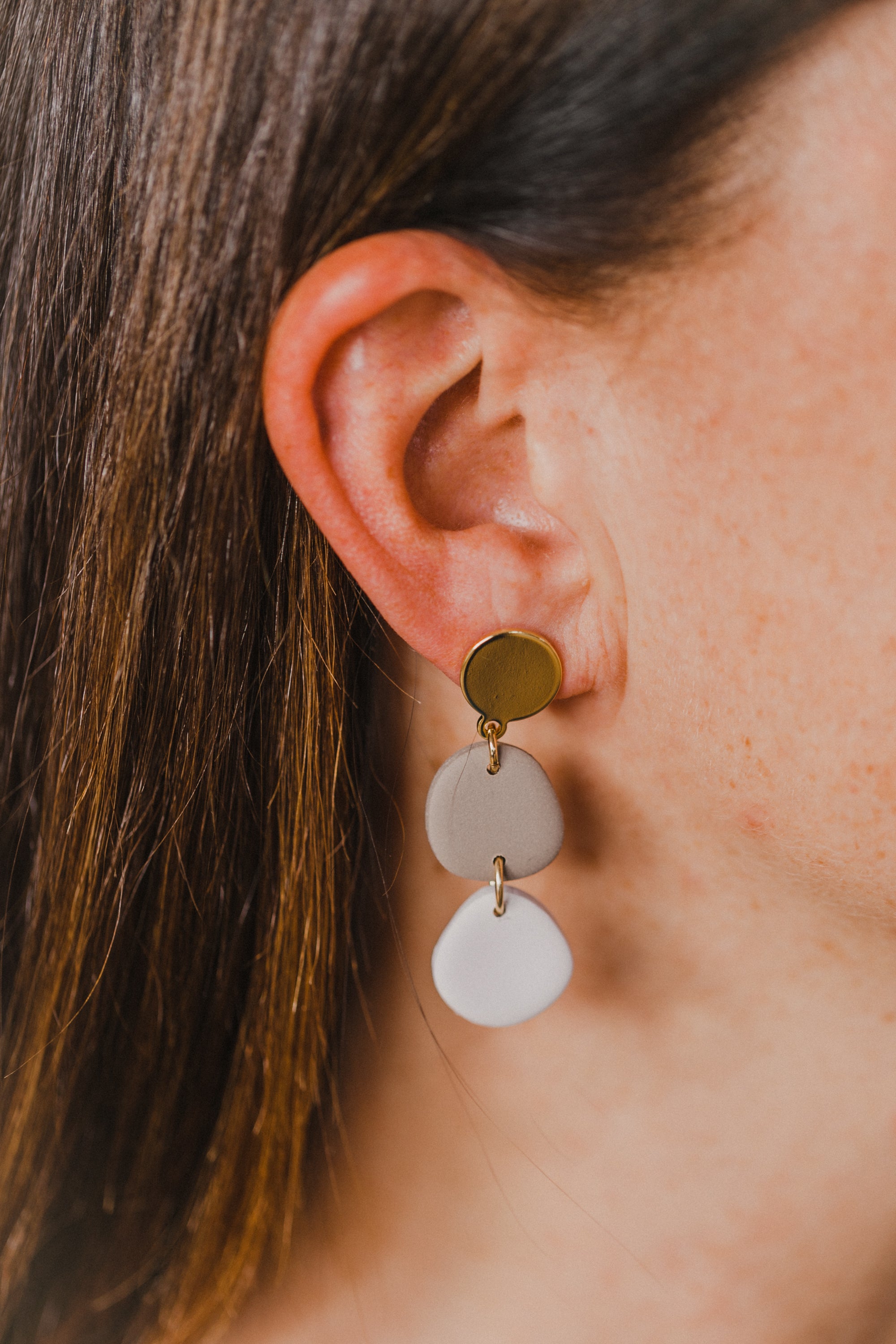 golden earrings with acrylic in white, petrol and brown