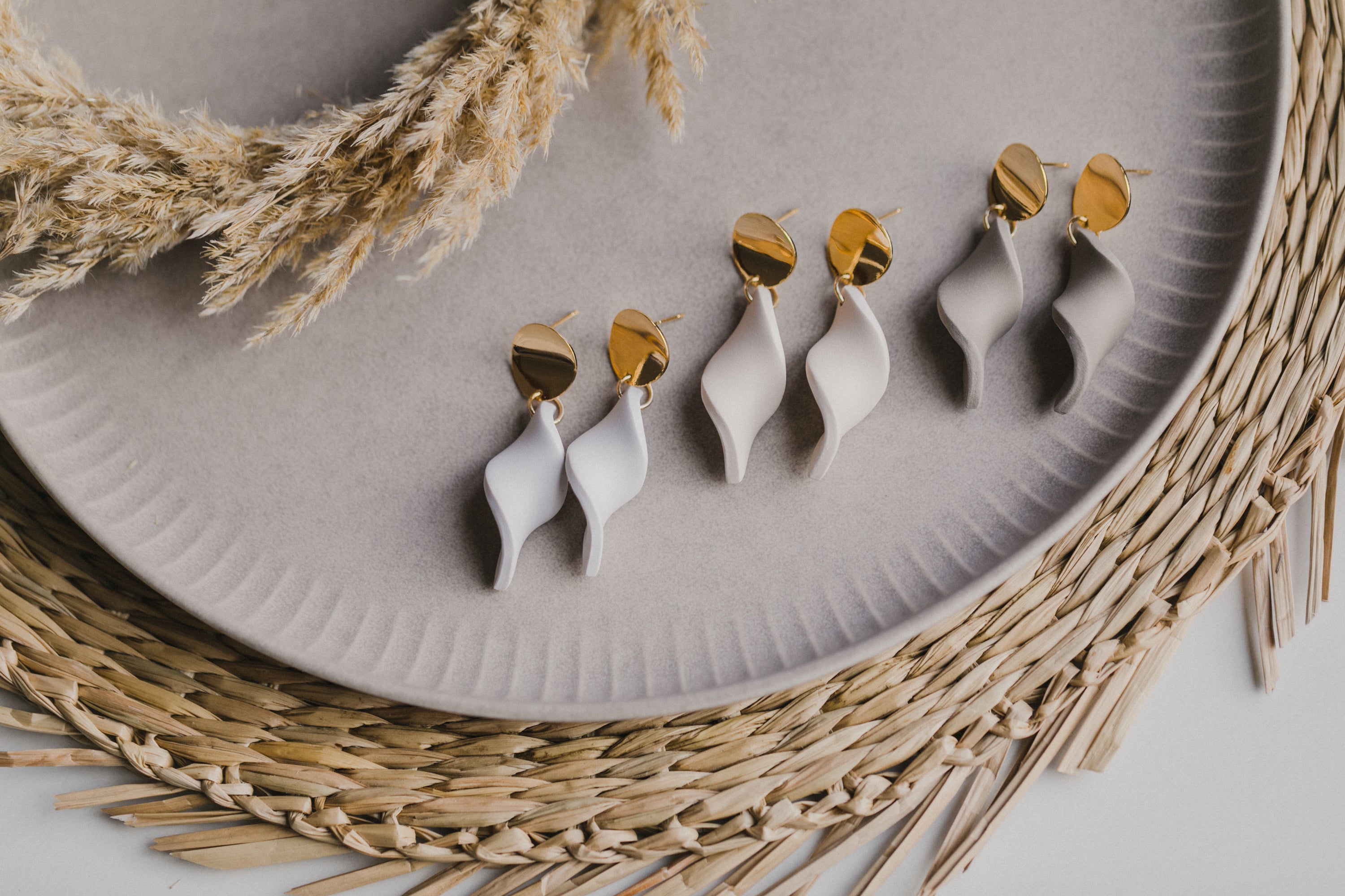 Hoop earrings with round polymer clay pendant and leaf