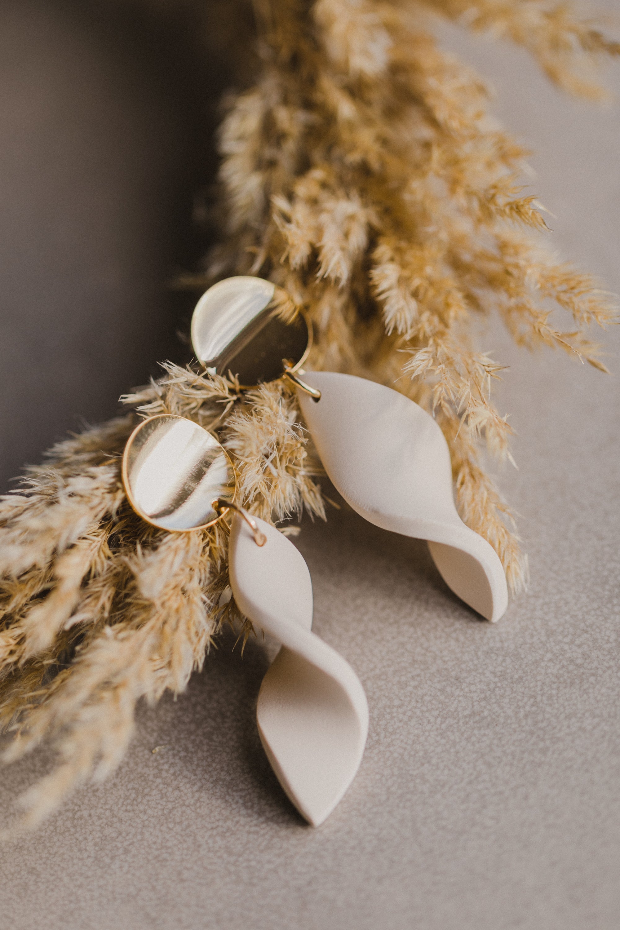 Hoop earrings with round polymer clay pendant and leaf