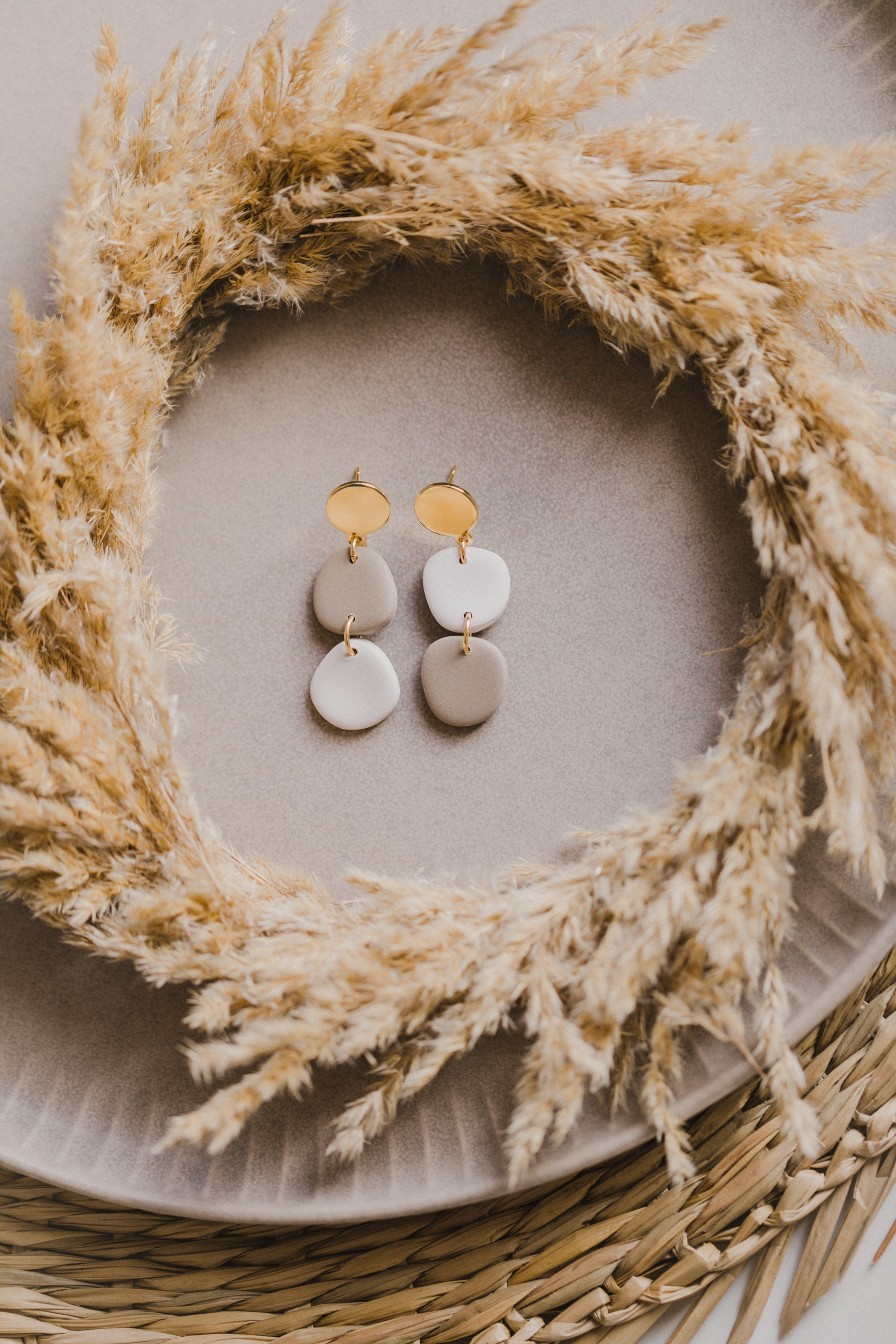 golden earrings with acrylic in white, petrol and brown