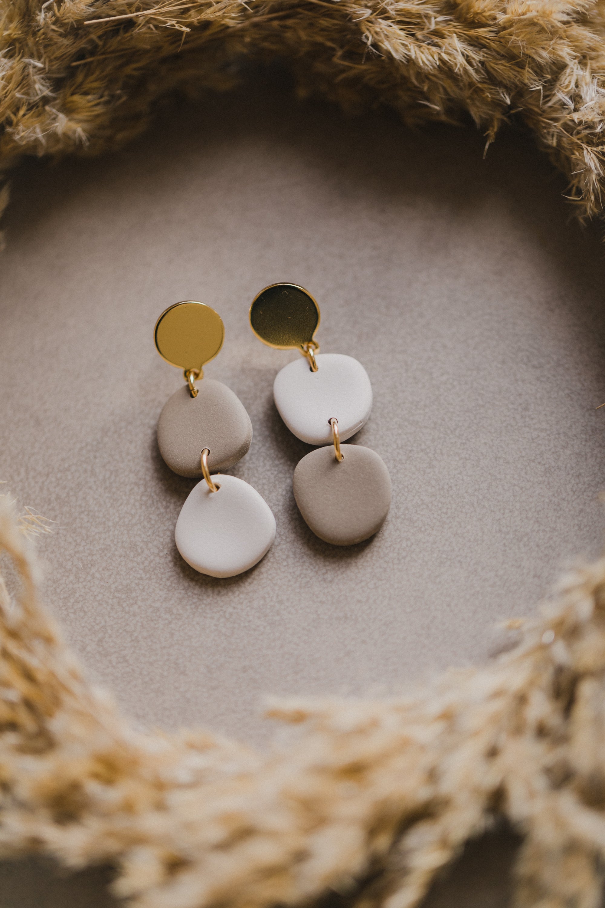 golden earrings with acrylic in white, petrol and brown