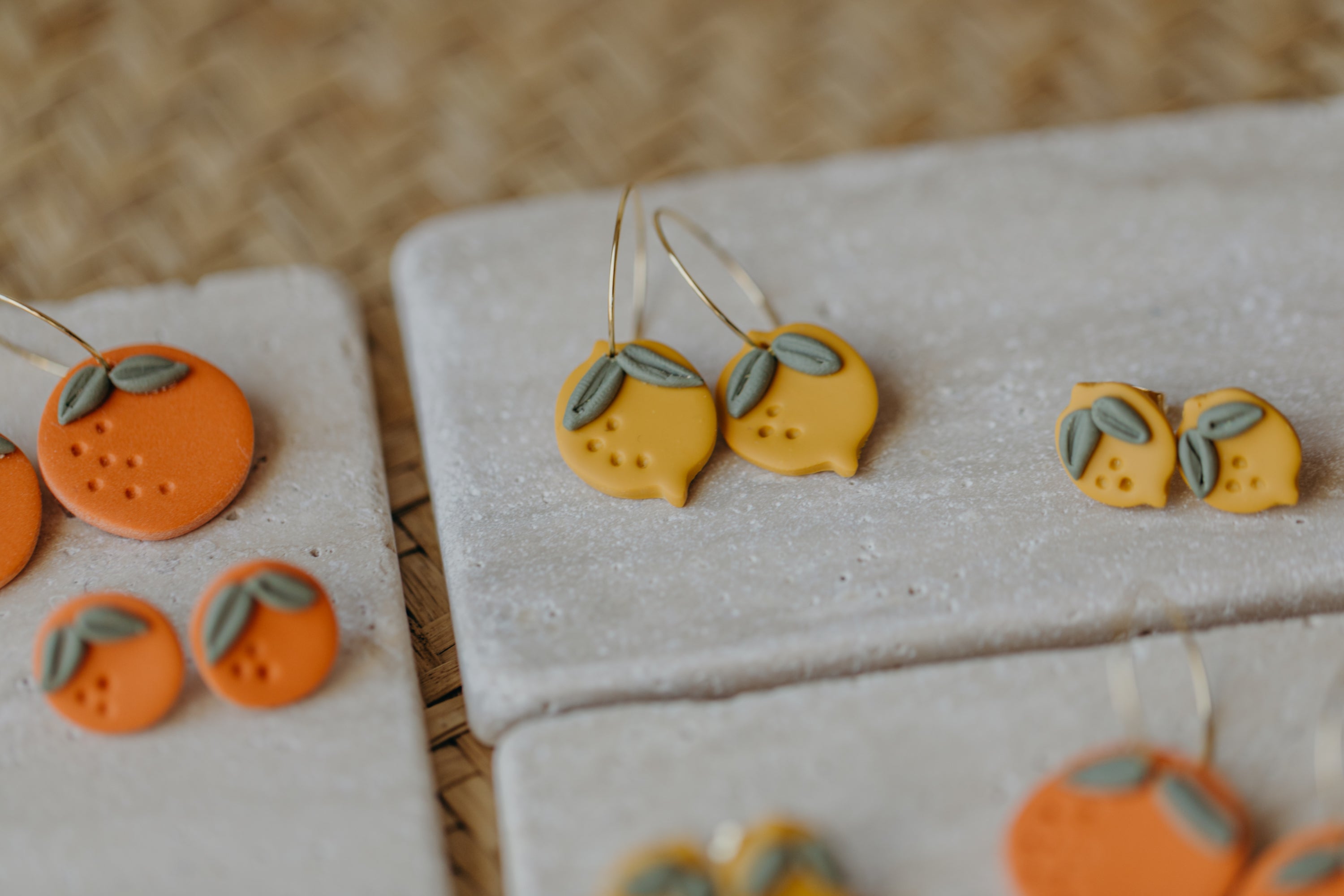 Hoop earrings with round polymer clay pendant and leaf