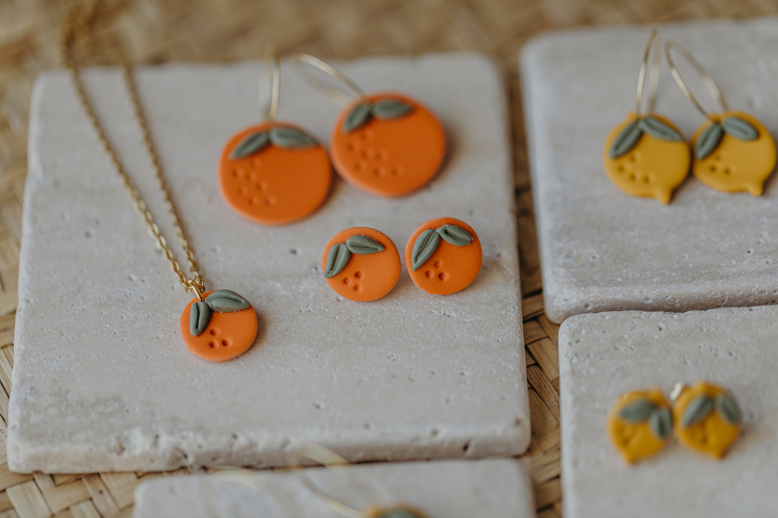 Hoop earrings with round polymer clay pendant and leaf