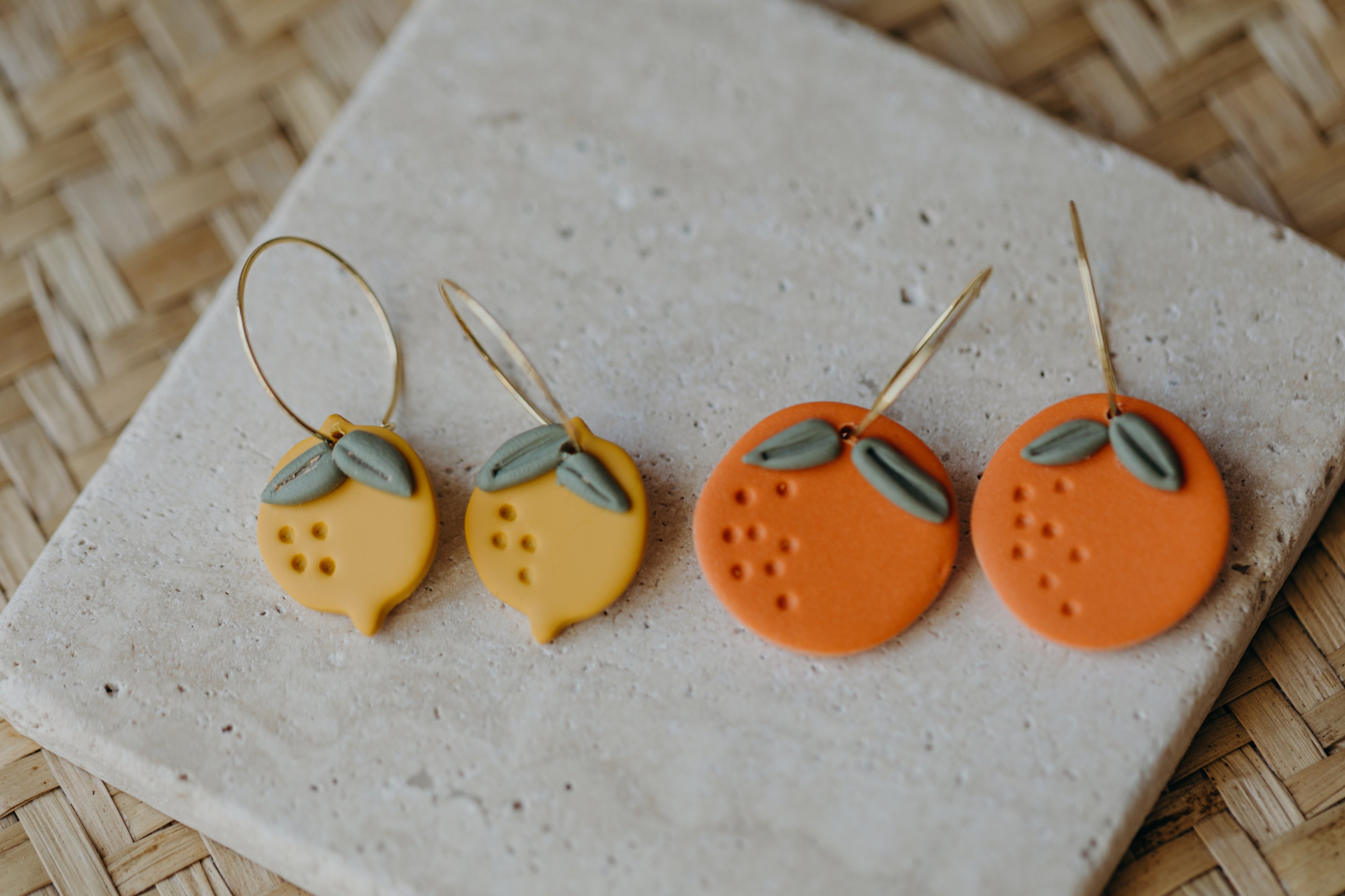 Hoop earrings with round polymer clay pendant and leaf