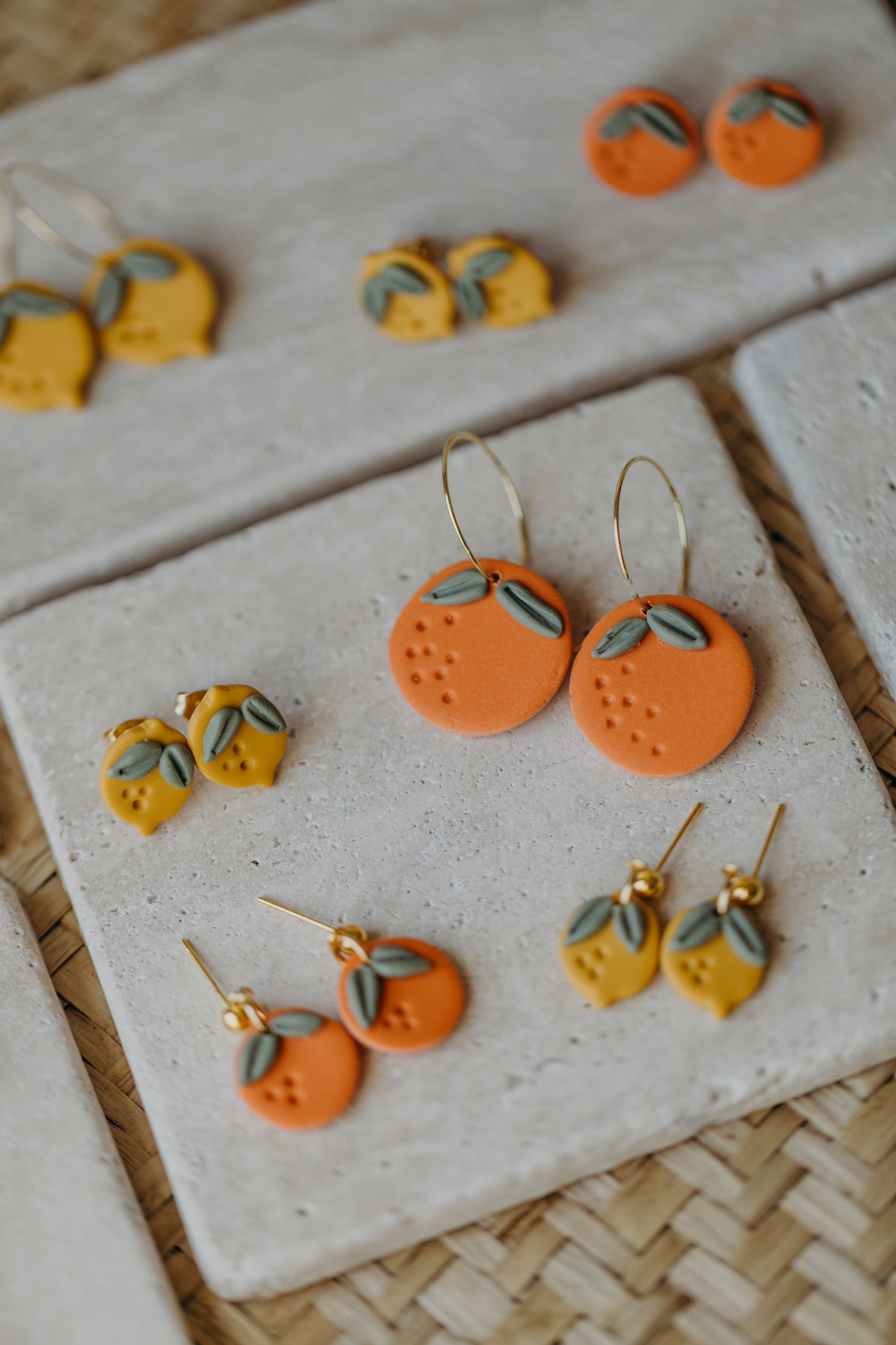 Hoop earrings with round polymer clay pendant and leaf