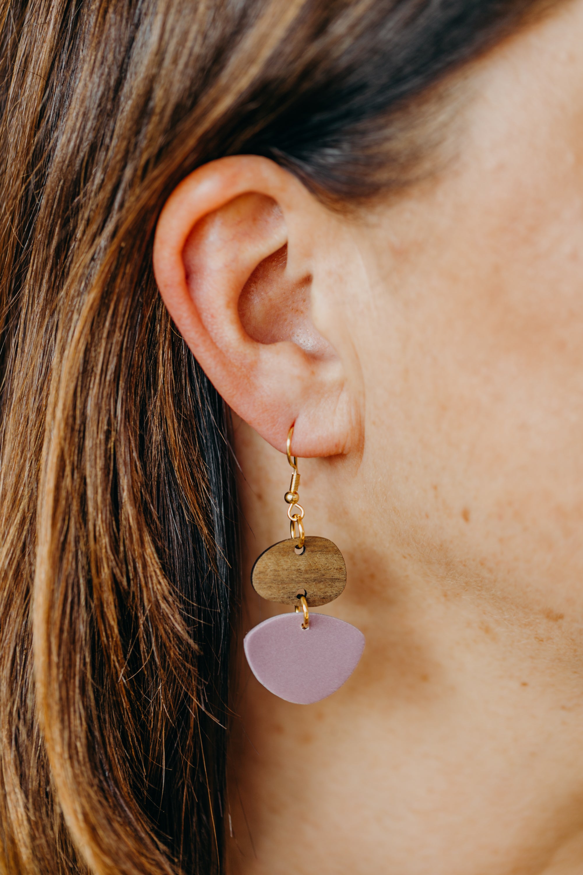 triangular polymer clay earrings in eucalyptus green with rectangular wooden pendant