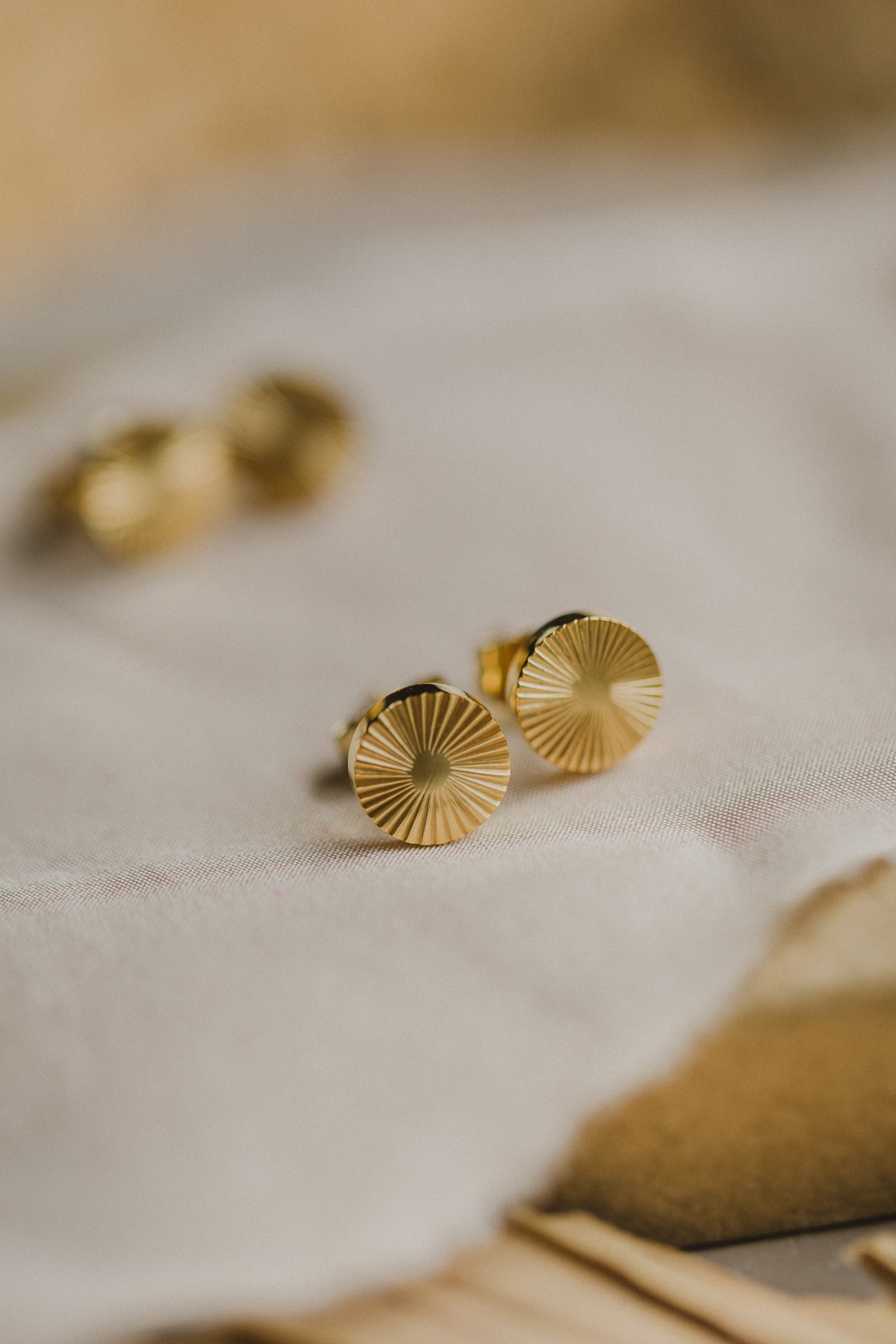 round titanium stud earrings with pattern