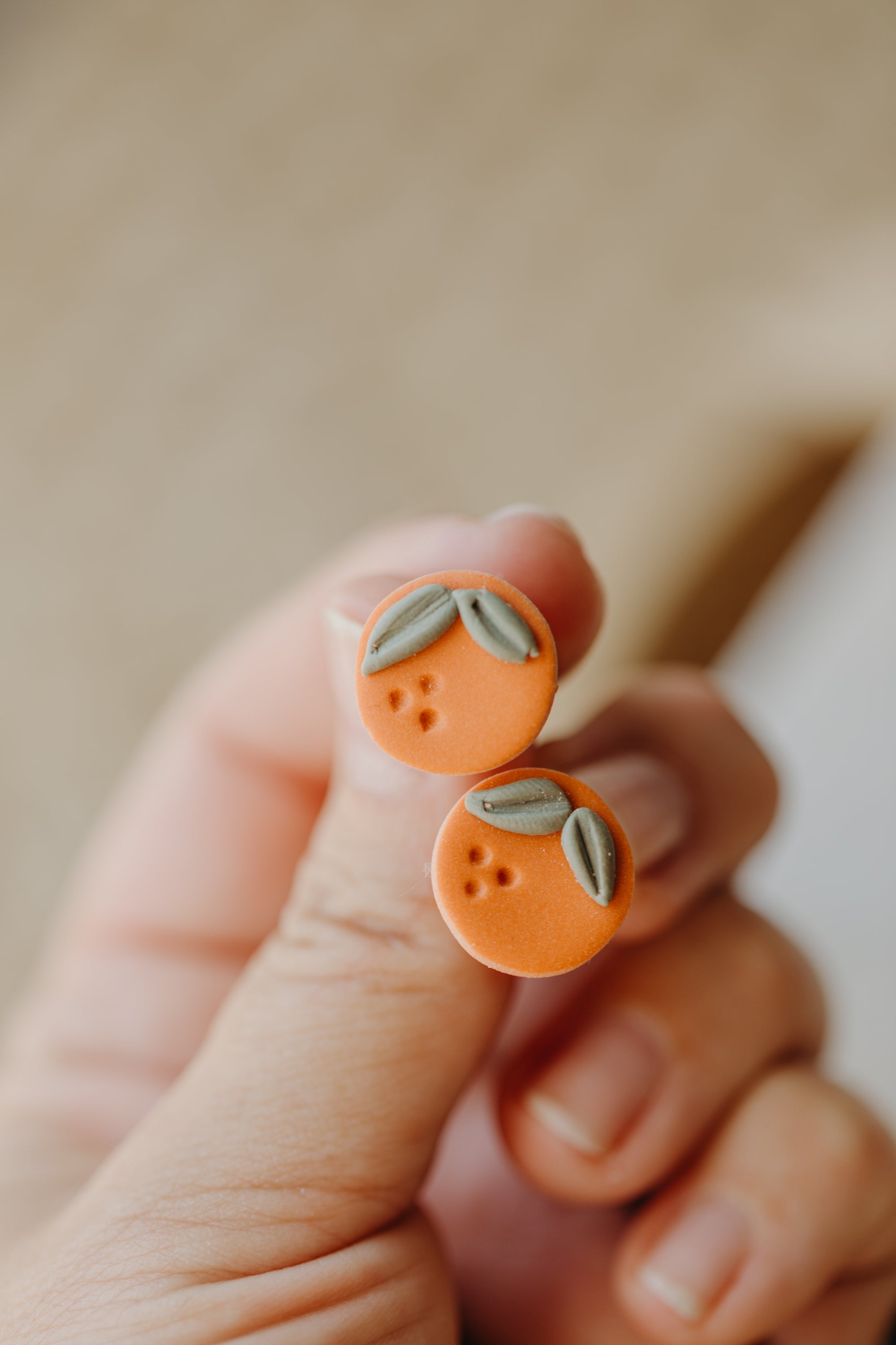 Hoop earrings with round polymer clay pendant and leaf