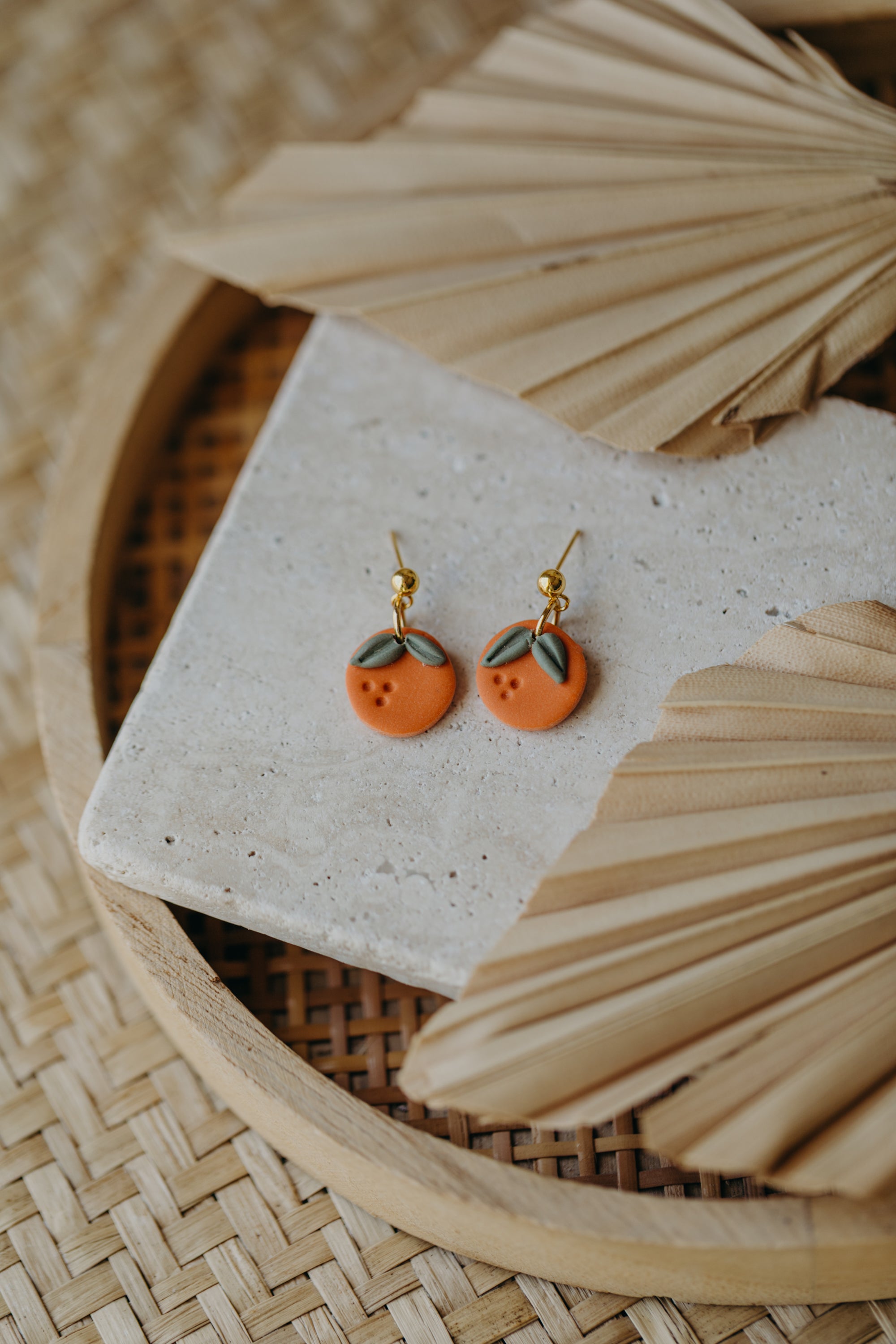 Hoop earrings with round polymer clay pendant and leaf