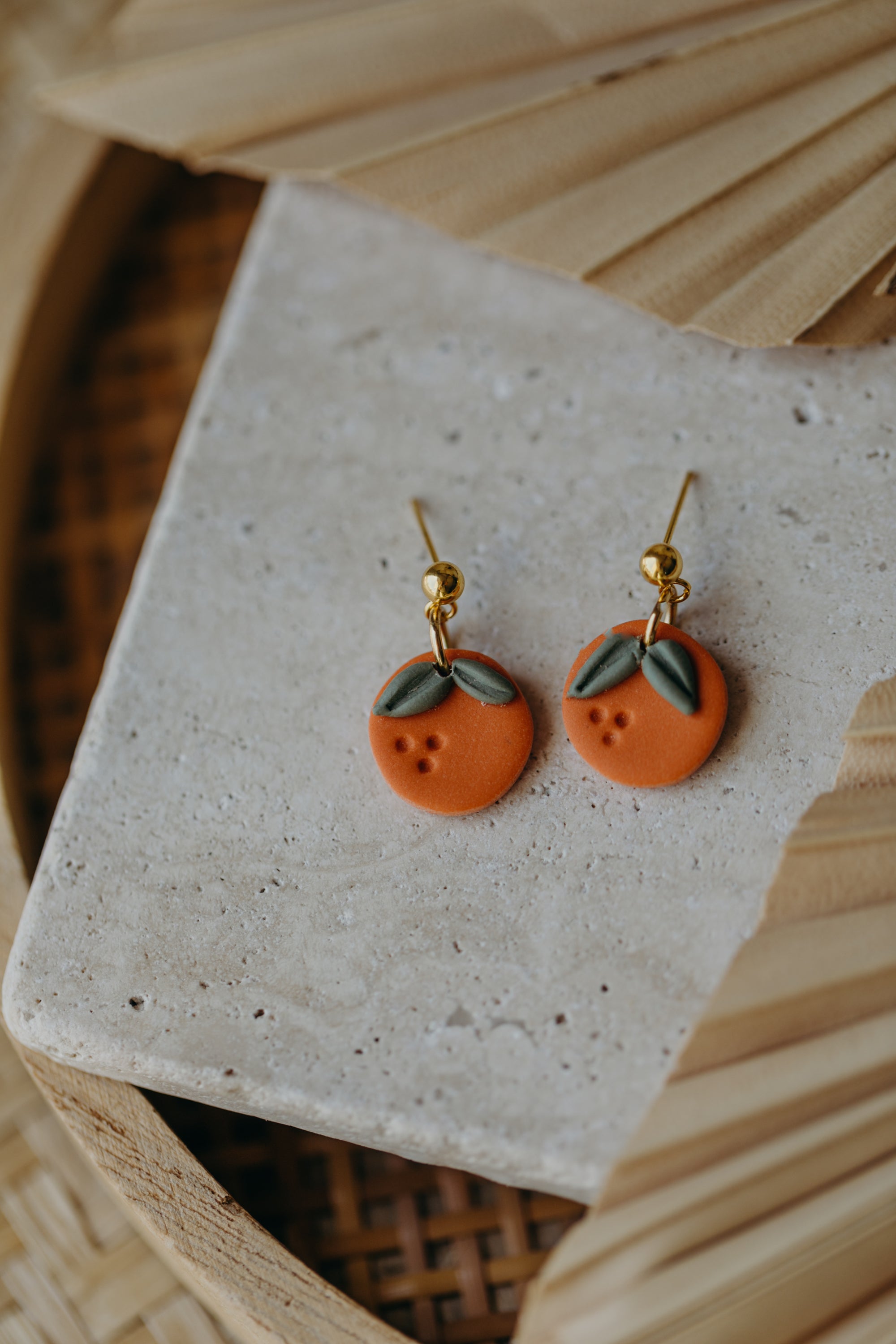 Hoop earrings with round polymer clay pendant and leaf