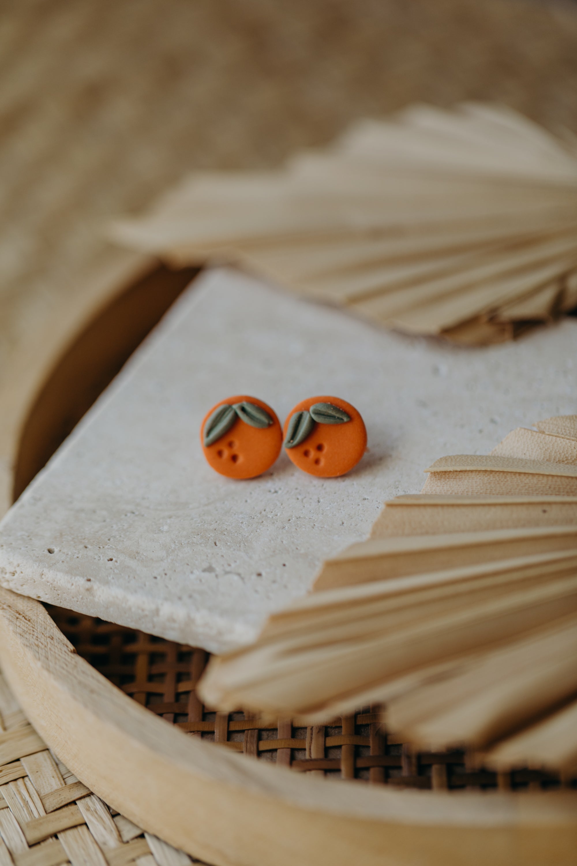 Hoop earrings with round polymer clay pendant and leaf