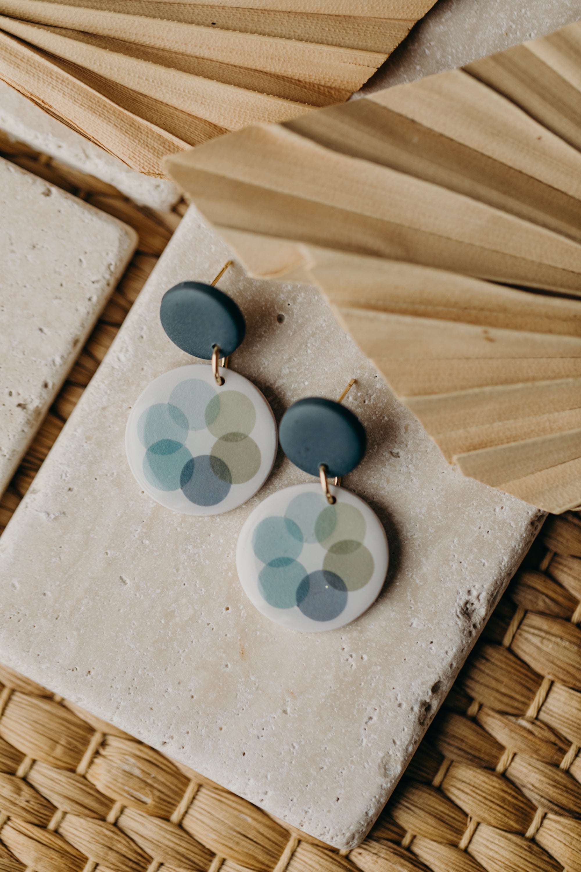 MARLA - round dark blue polymer clay earrings with blue and green dots