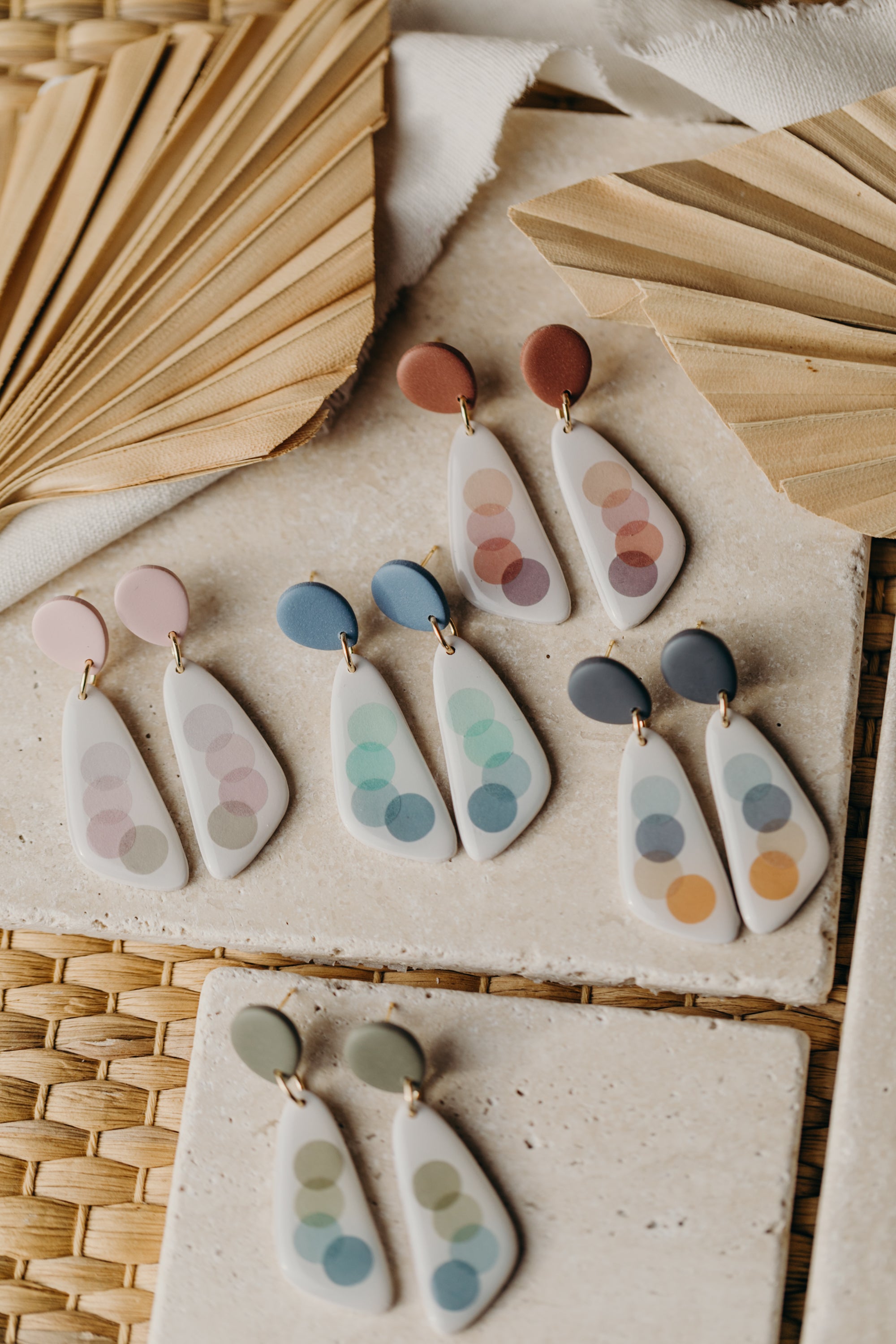 elongated polymer clay earrings with pink dots