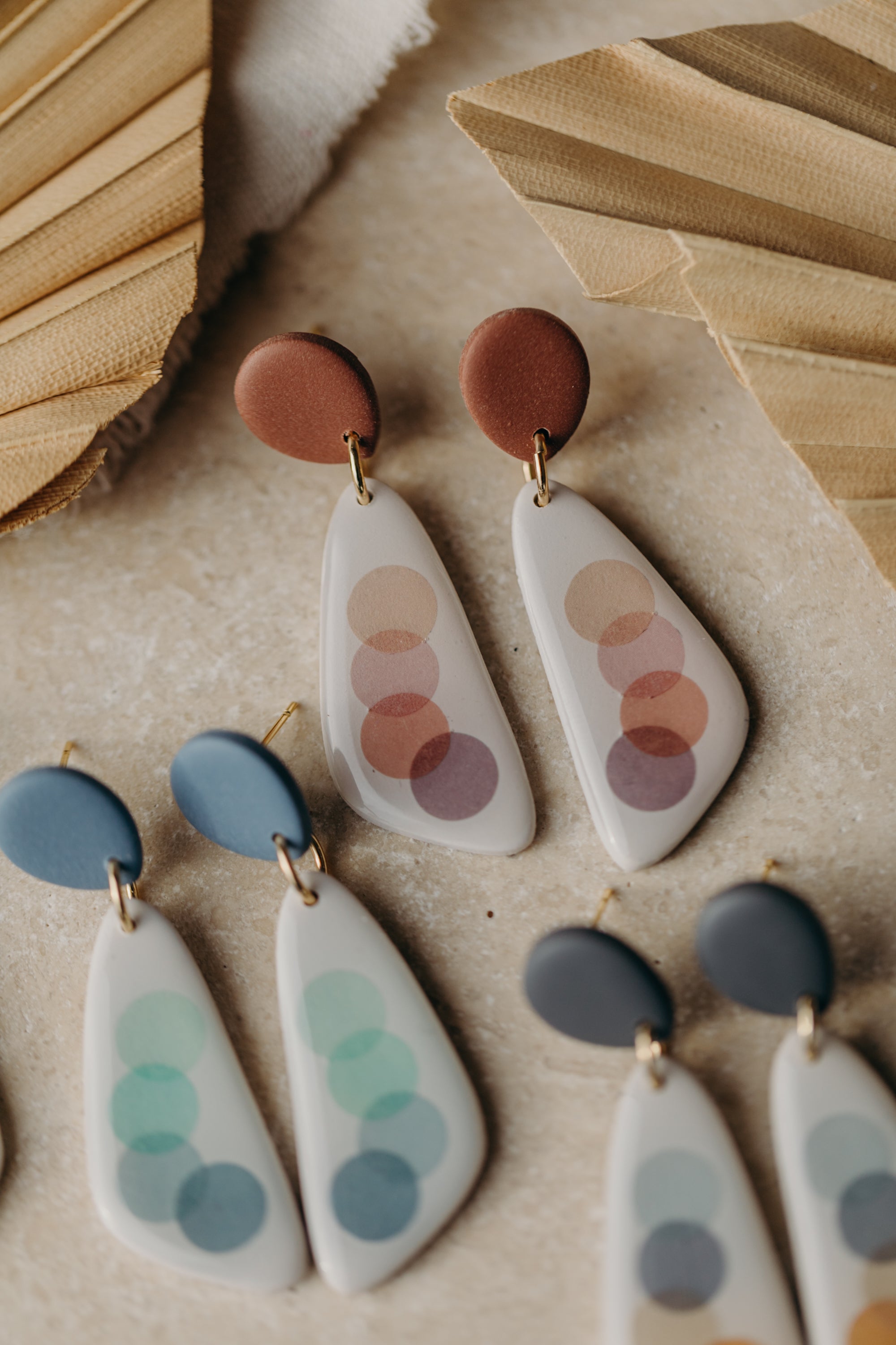 elongated polymer clay earrings with pink dots