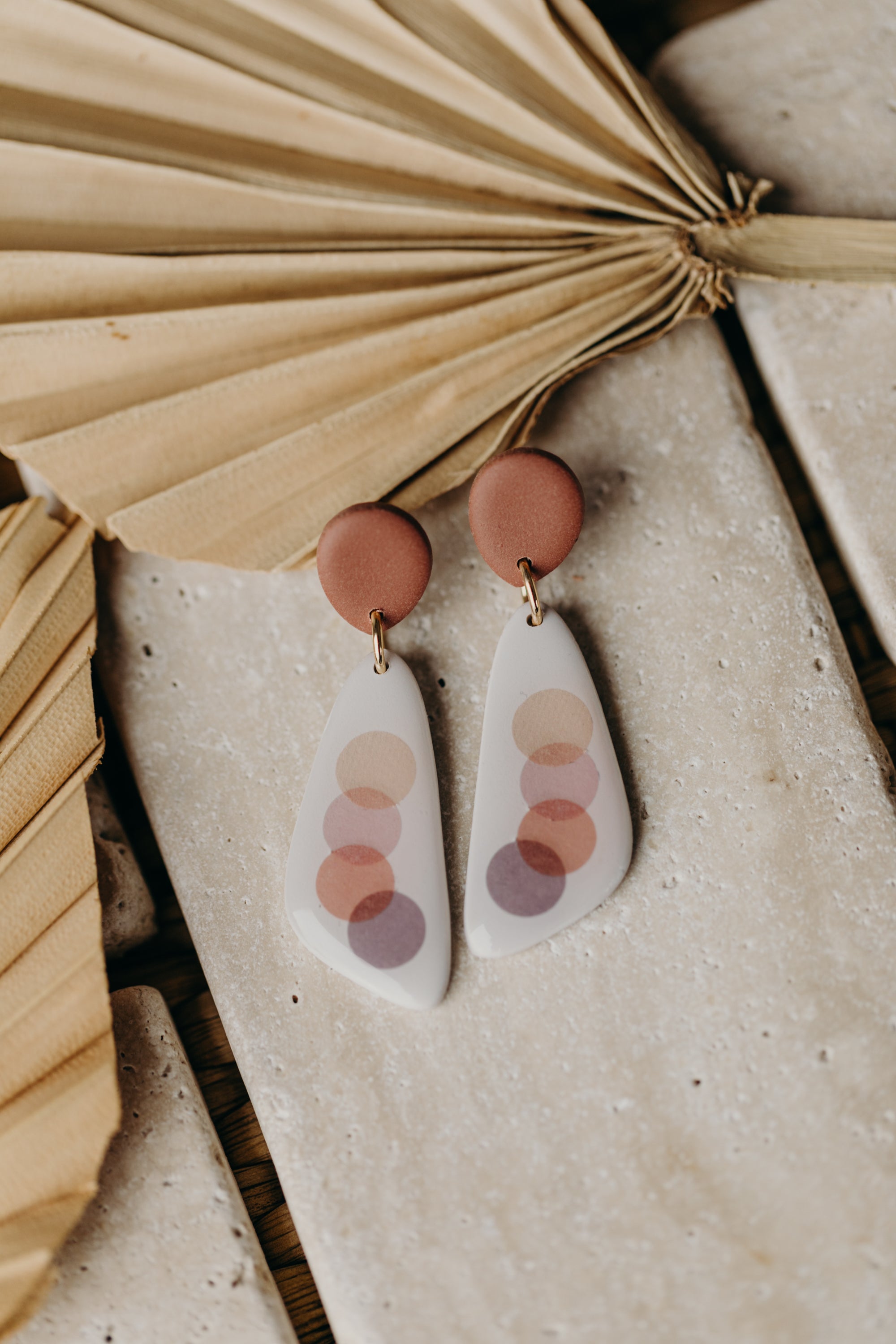 elongated polymer clay earrings with pink dots