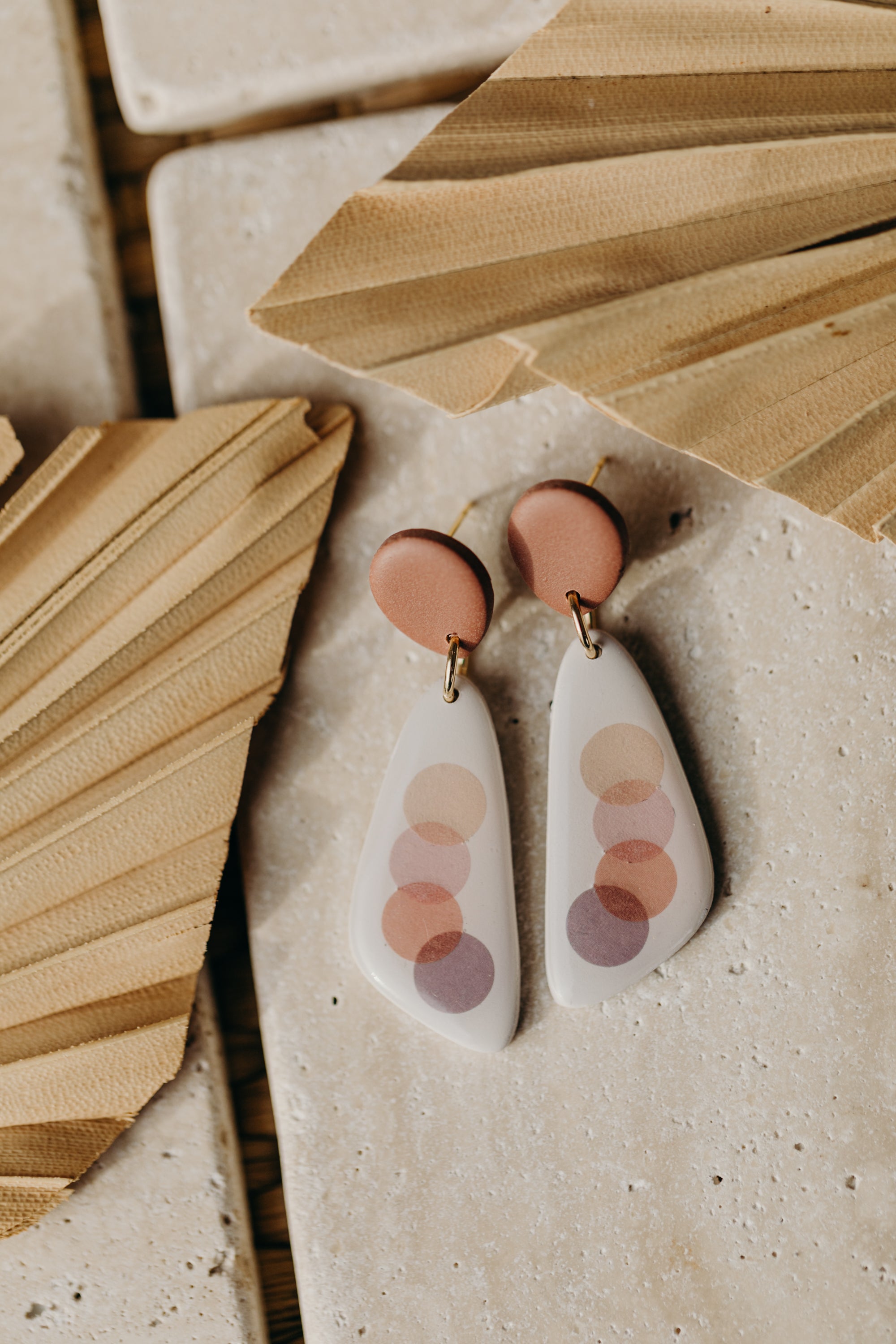 elongated polymer clay earrings with pink dots