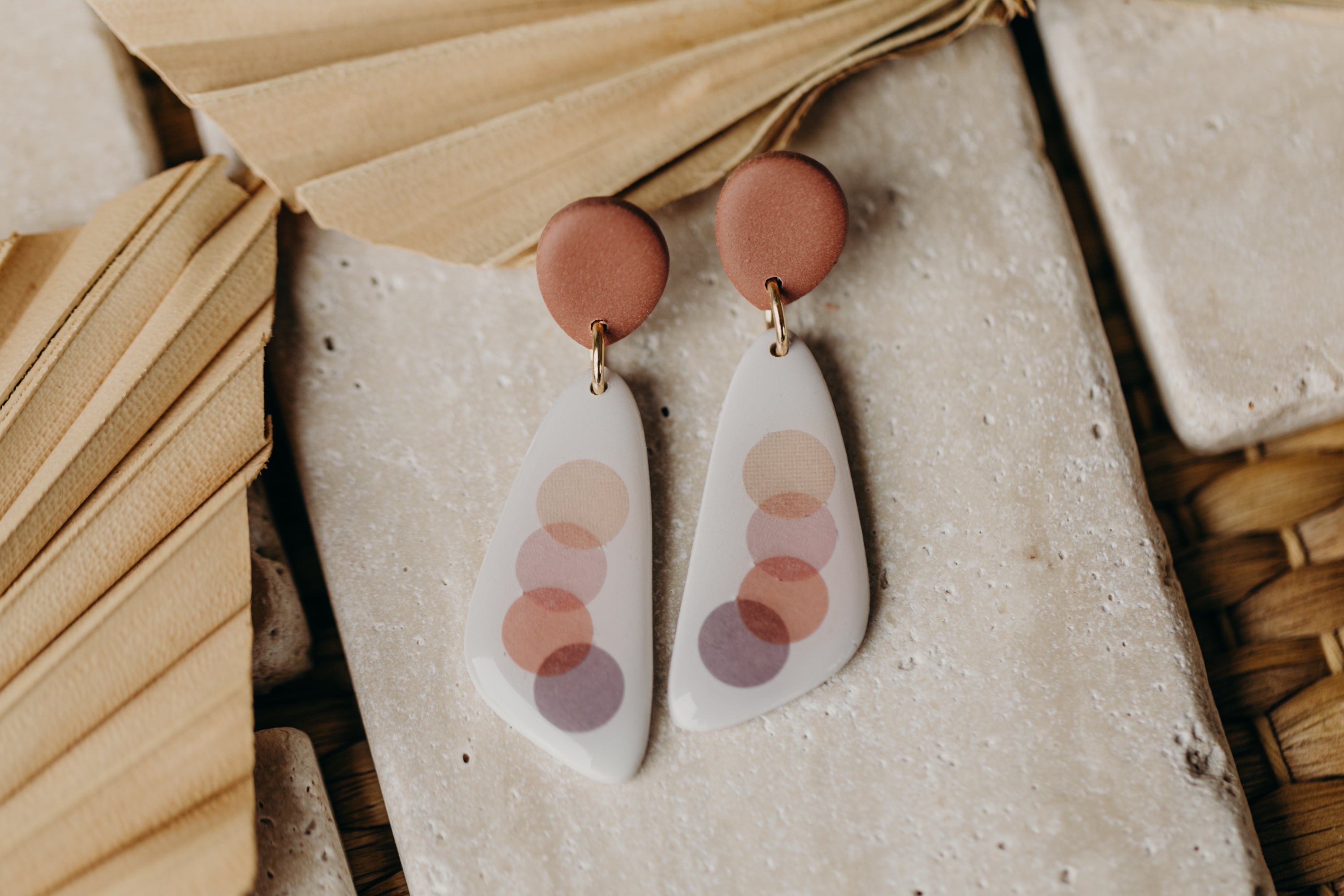 elongated polymer clay earrings with pink dots