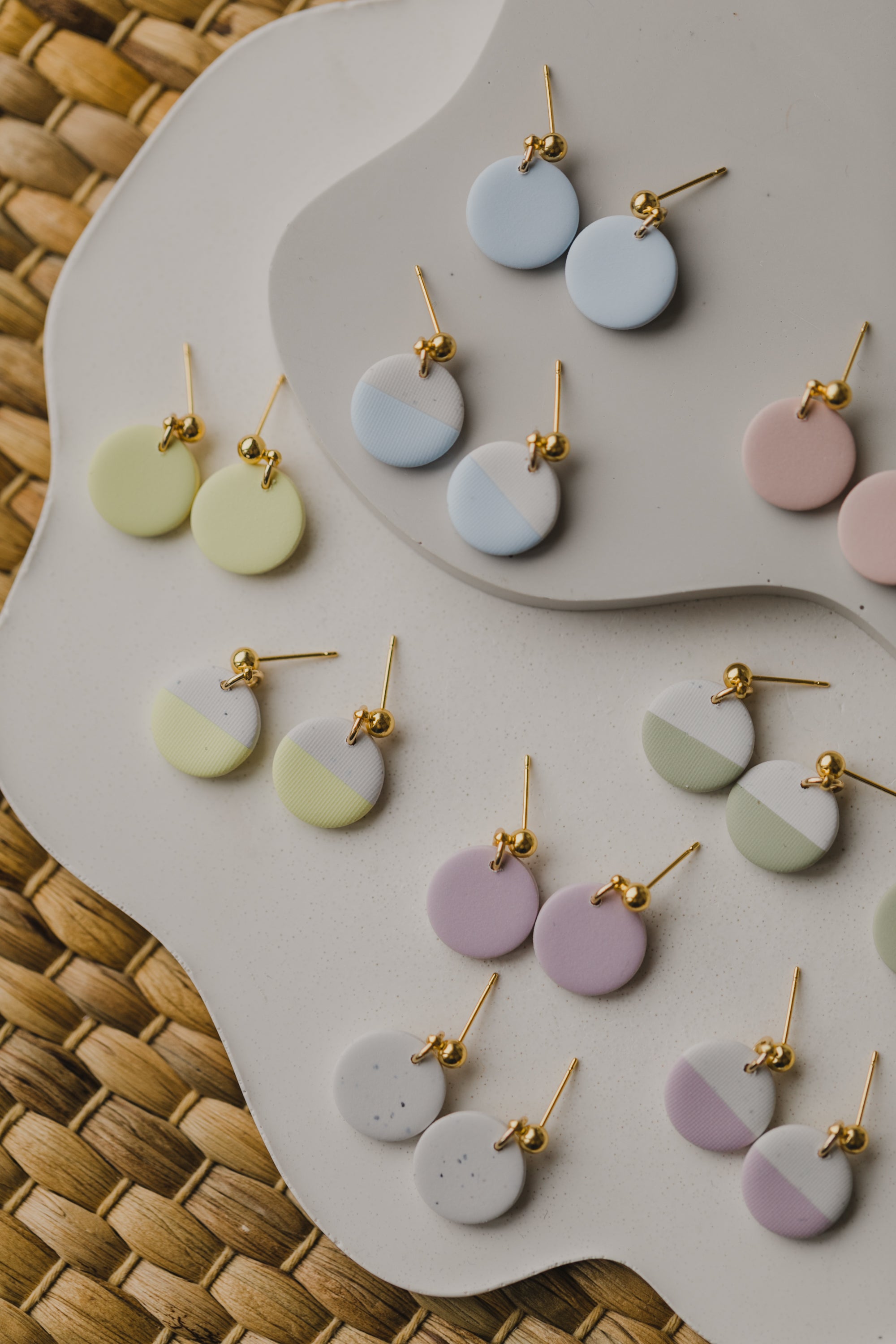 round earrings made of polymer clay in pastel colors
