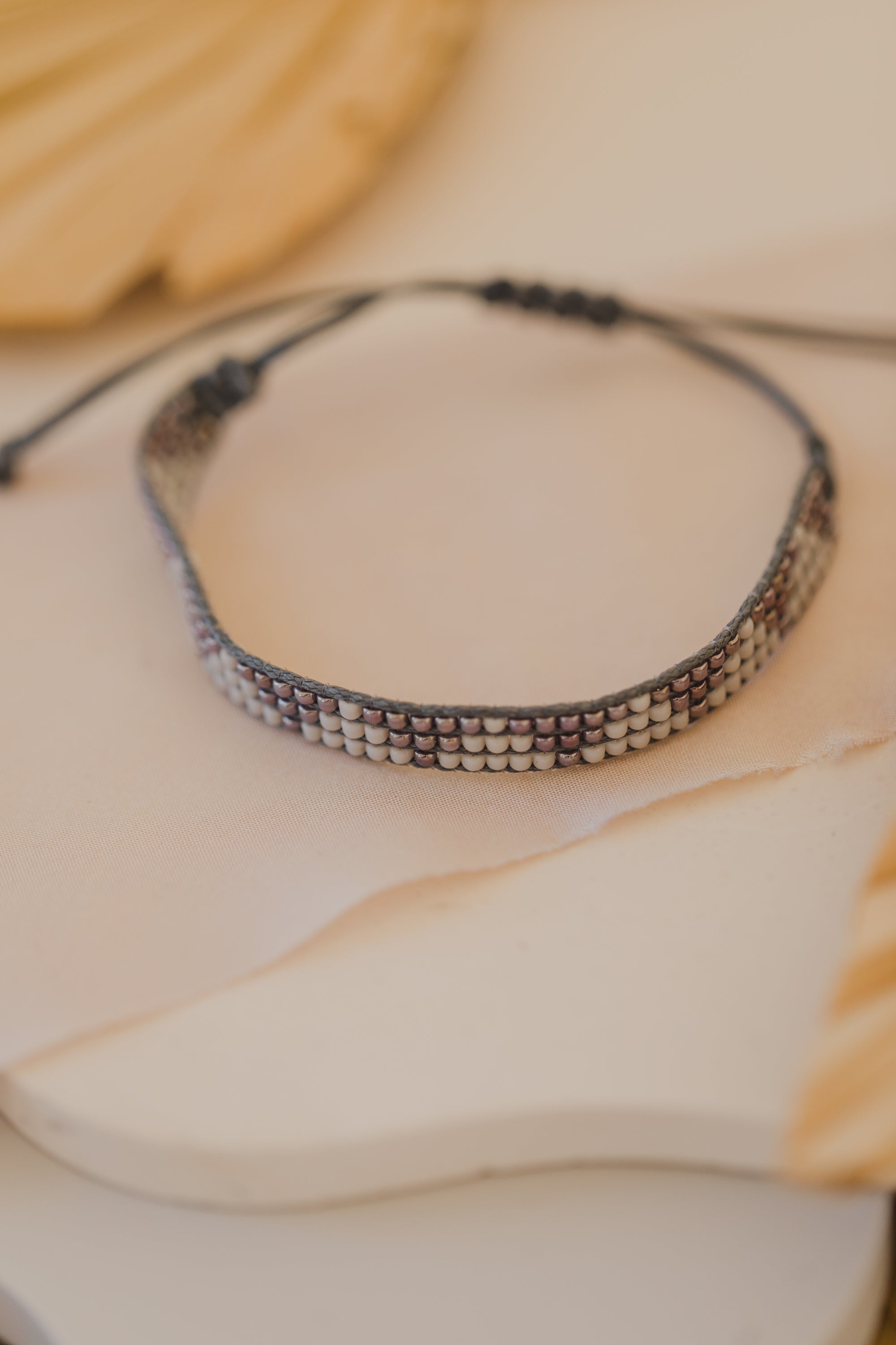 gray bracelet made of rocaille beads