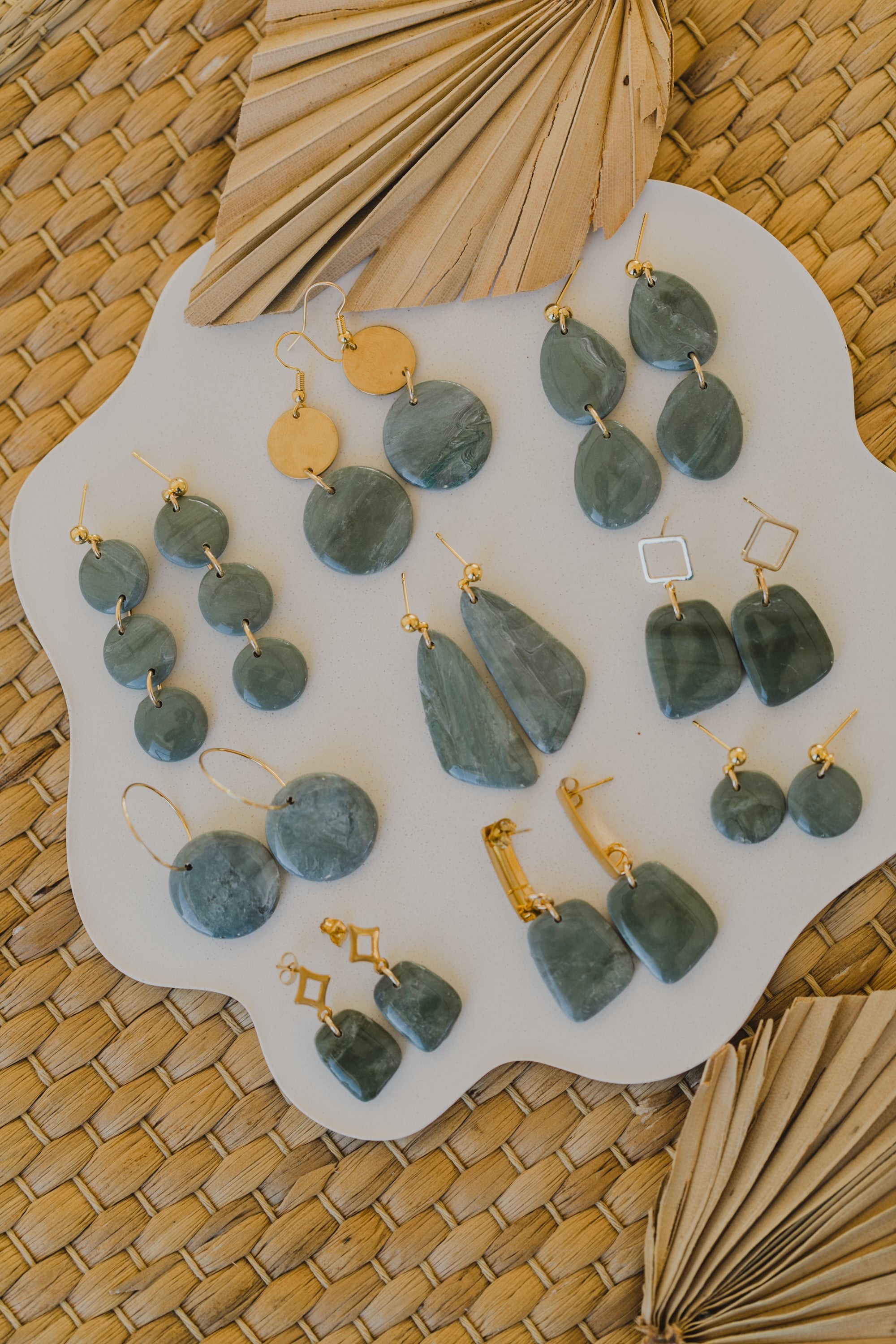 Hoop earrings with round polymer clay pendant and leaf