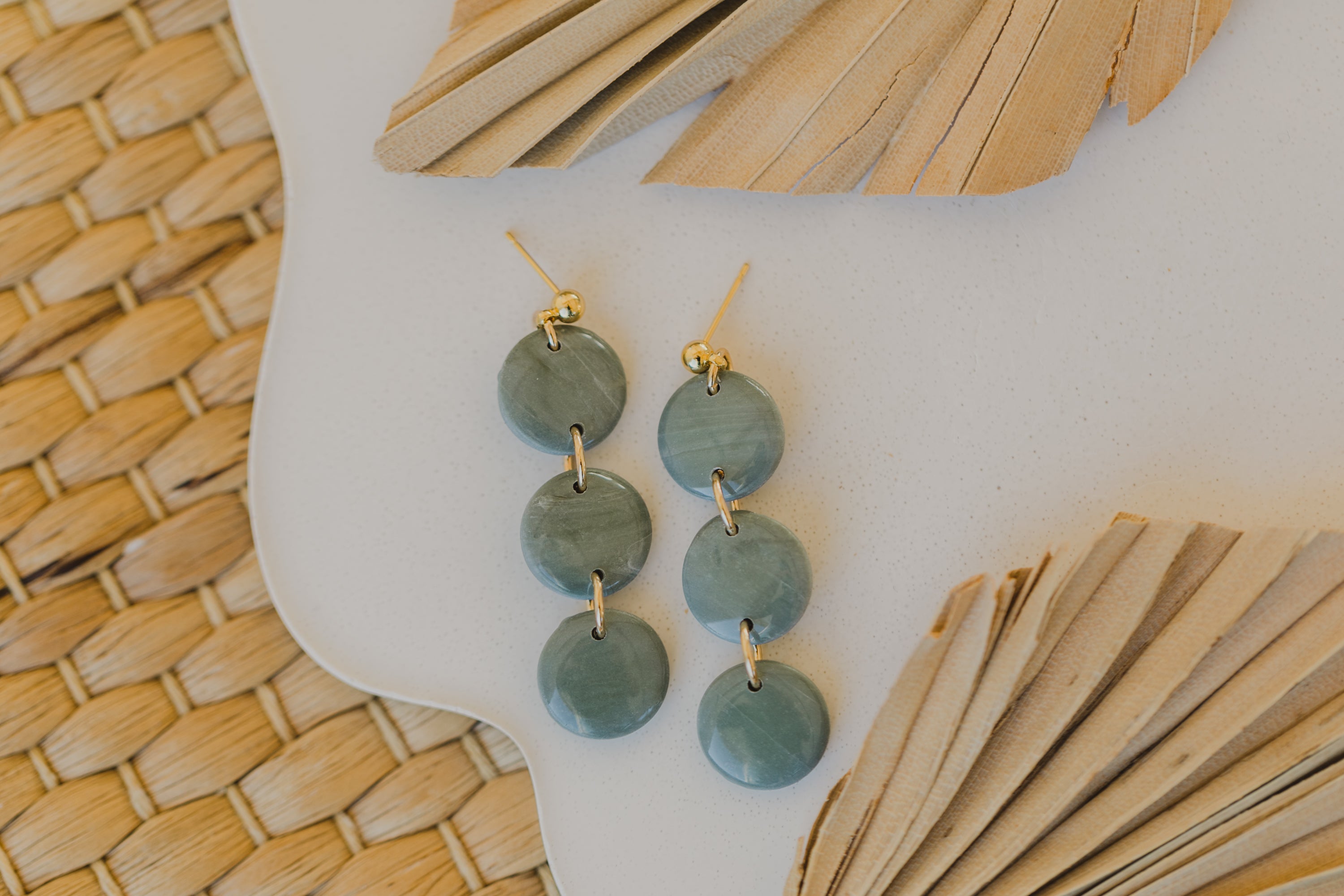 Hoop earrings with round polymer clay pendant and leaf