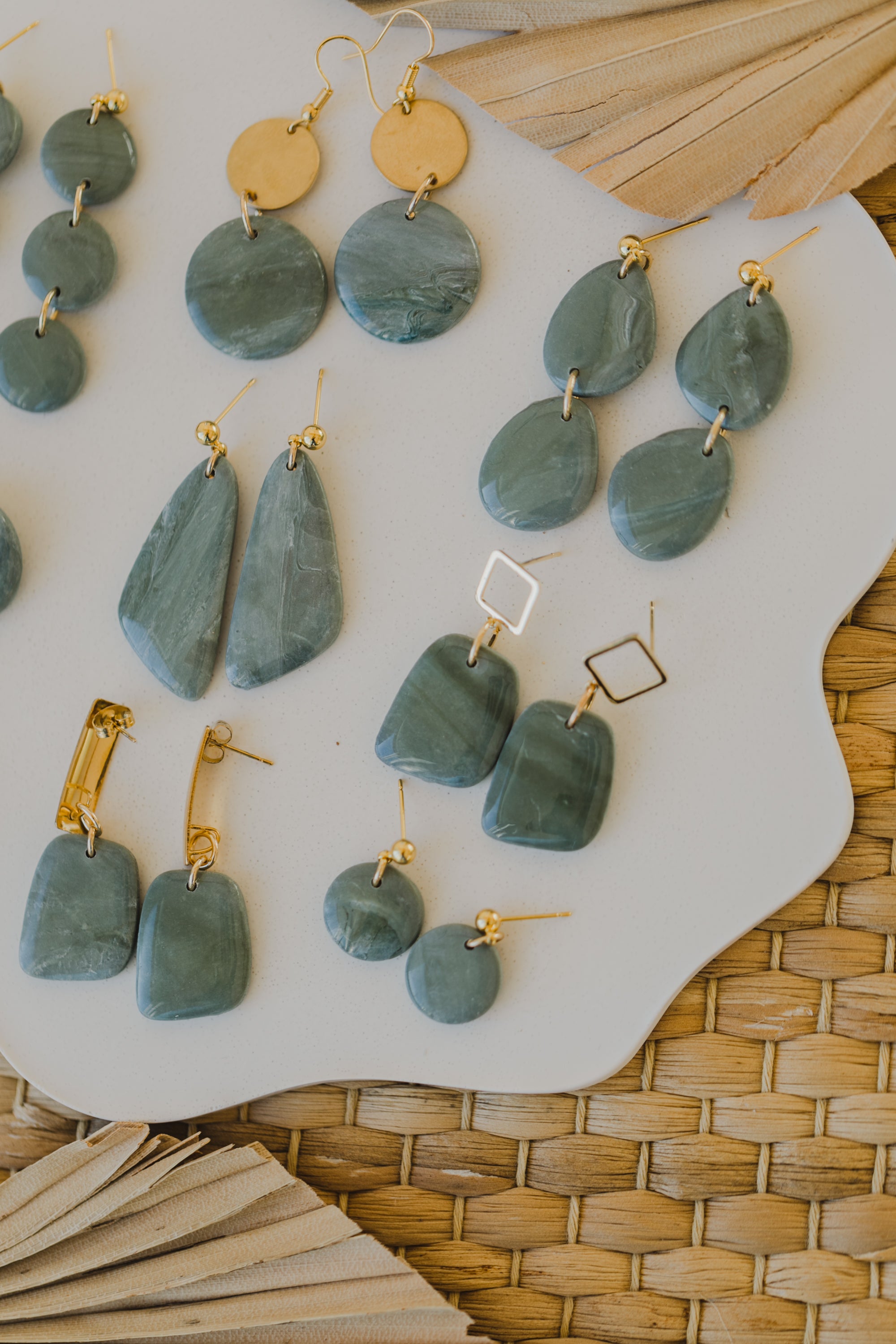 Hoop earrings with round polymer clay pendant and leaf