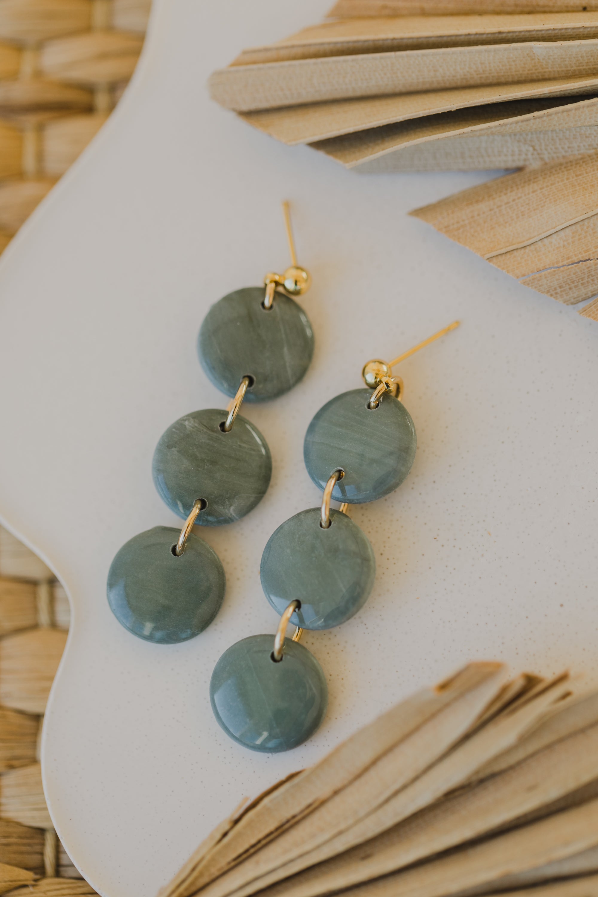 Hoop earrings with round polymer clay pendant and leaf