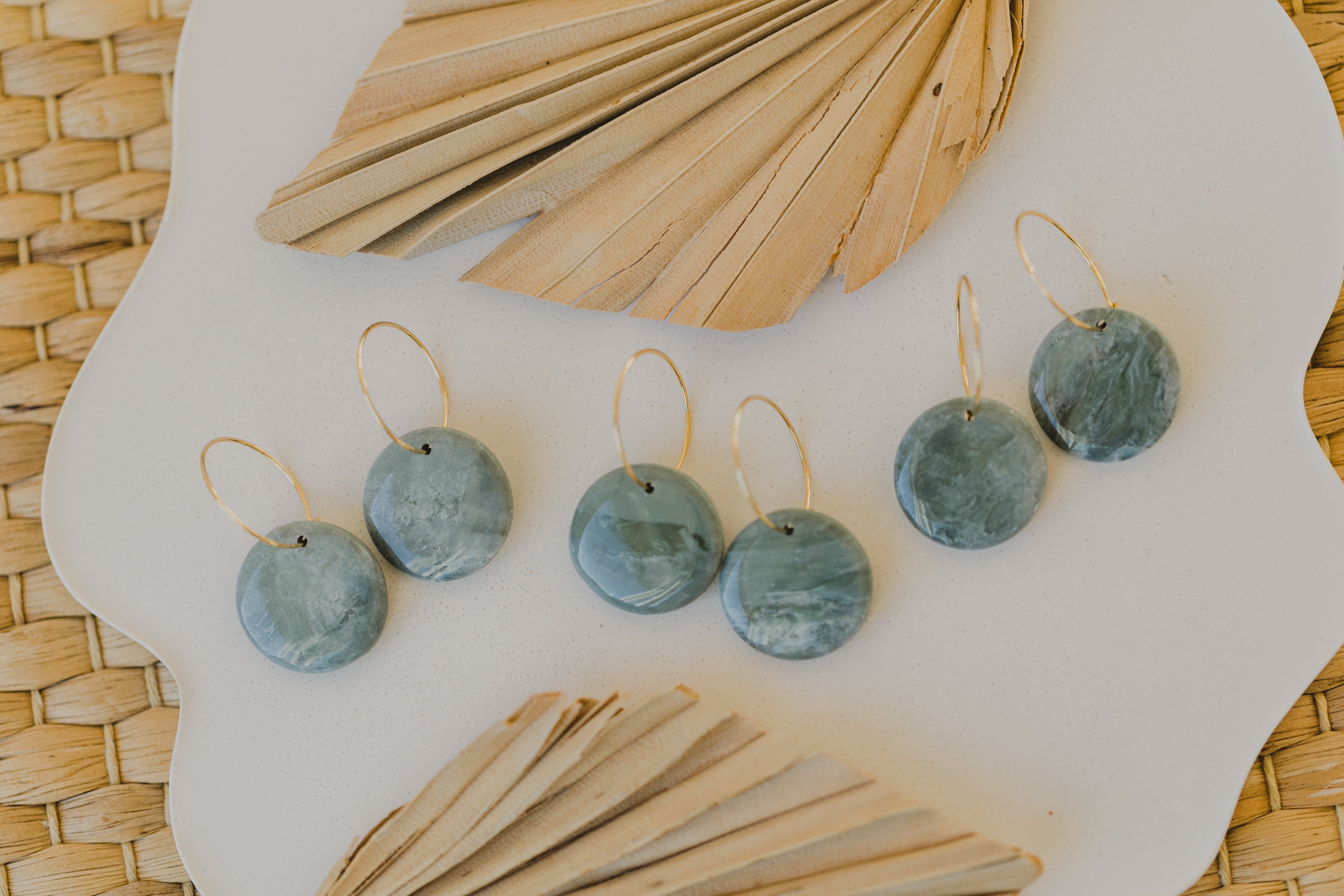 Hoop earrings with round polymer clay pendant and leaf