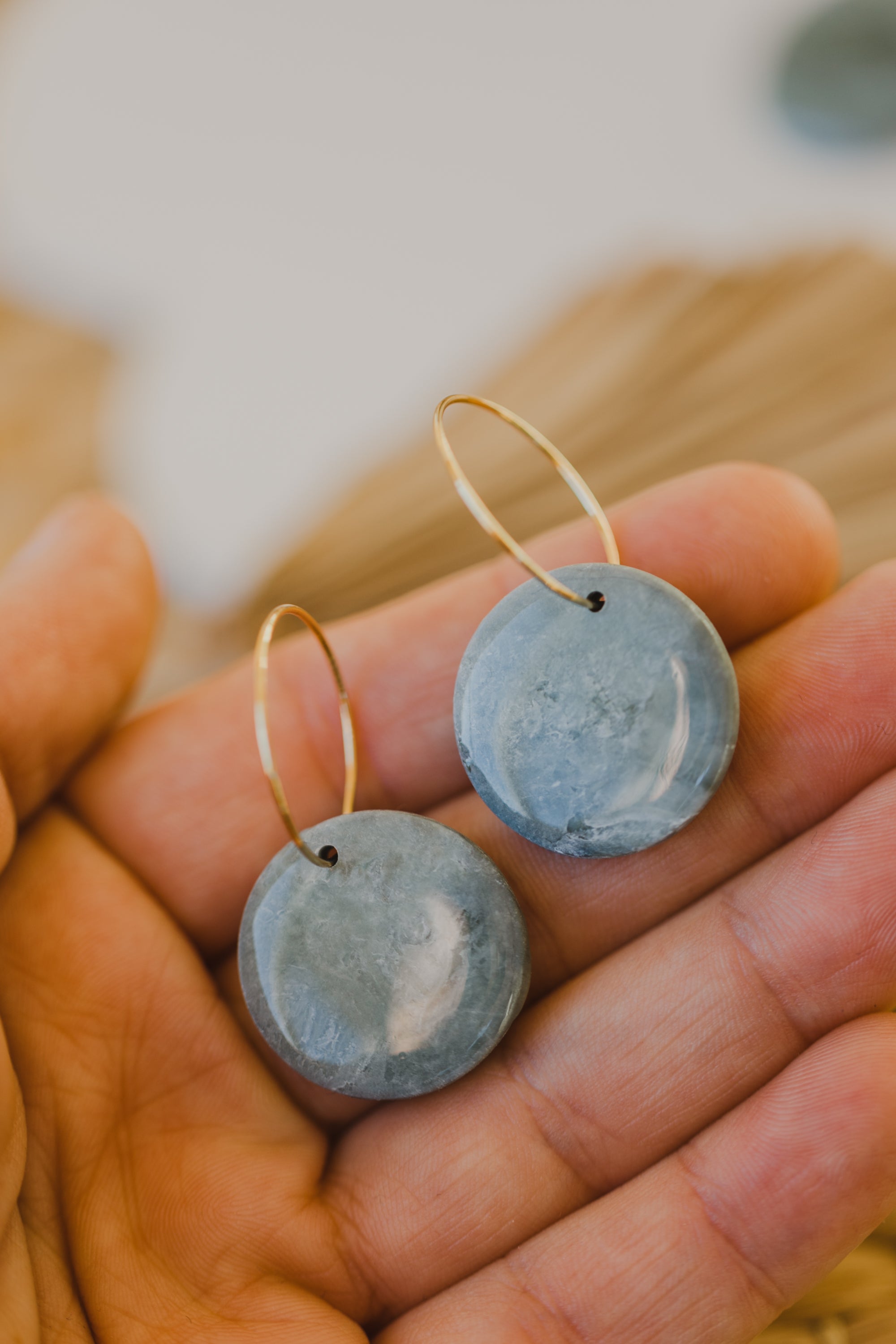 Hoop earrings with round polymer clay pendant and leaf