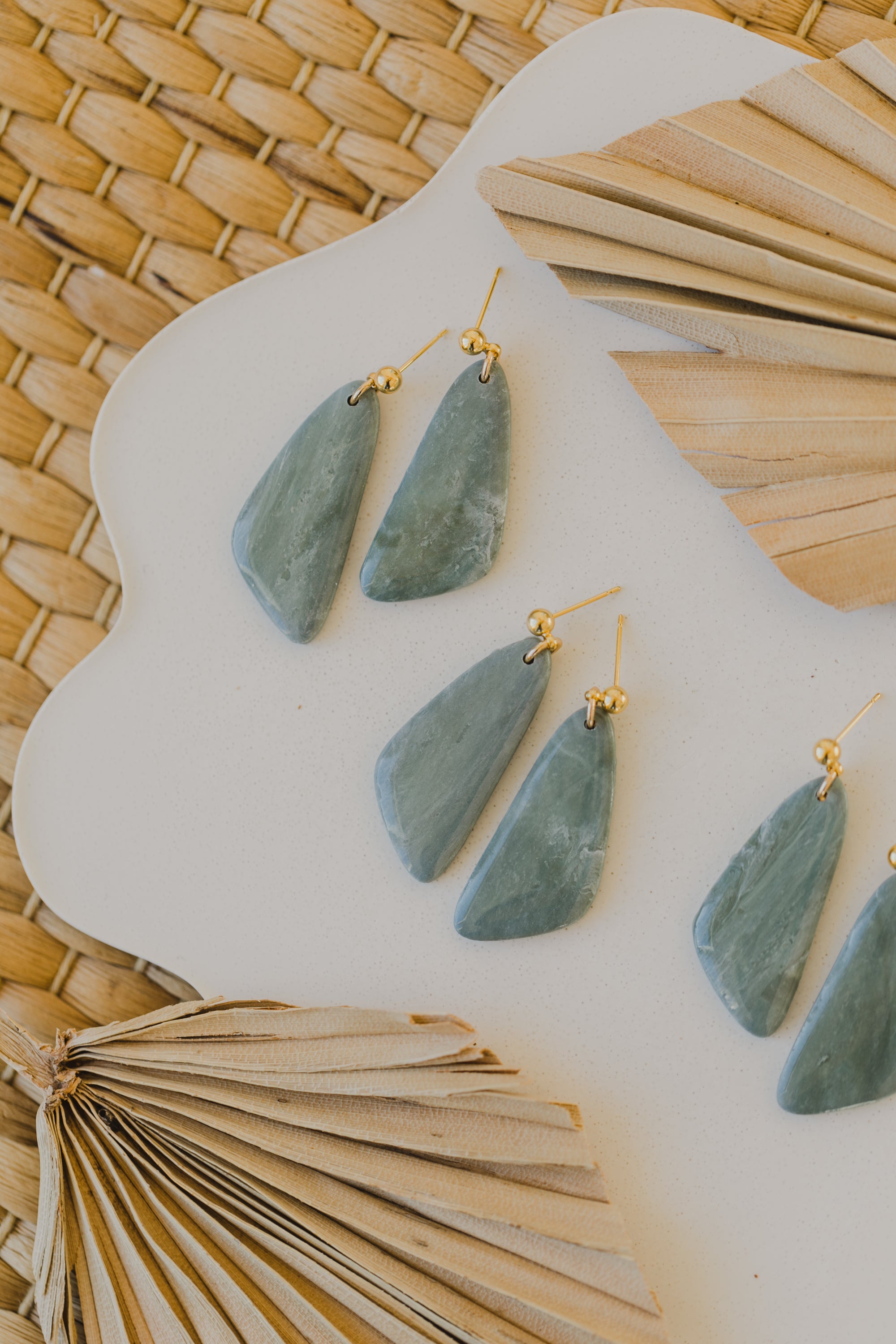 Hoop earrings with round polymer clay pendant and leaf