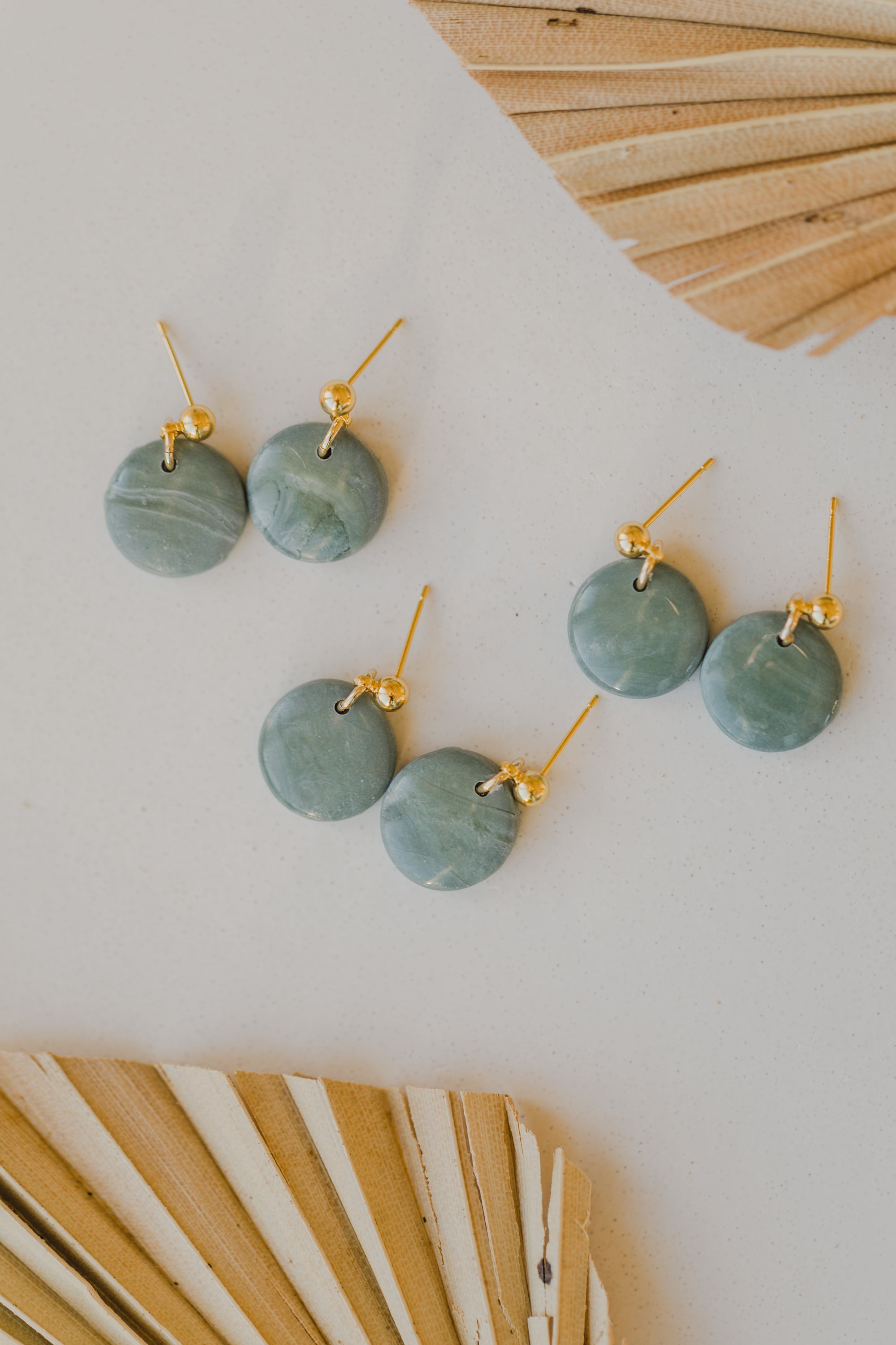 Hoop earrings with round polymer clay pendant and leaf