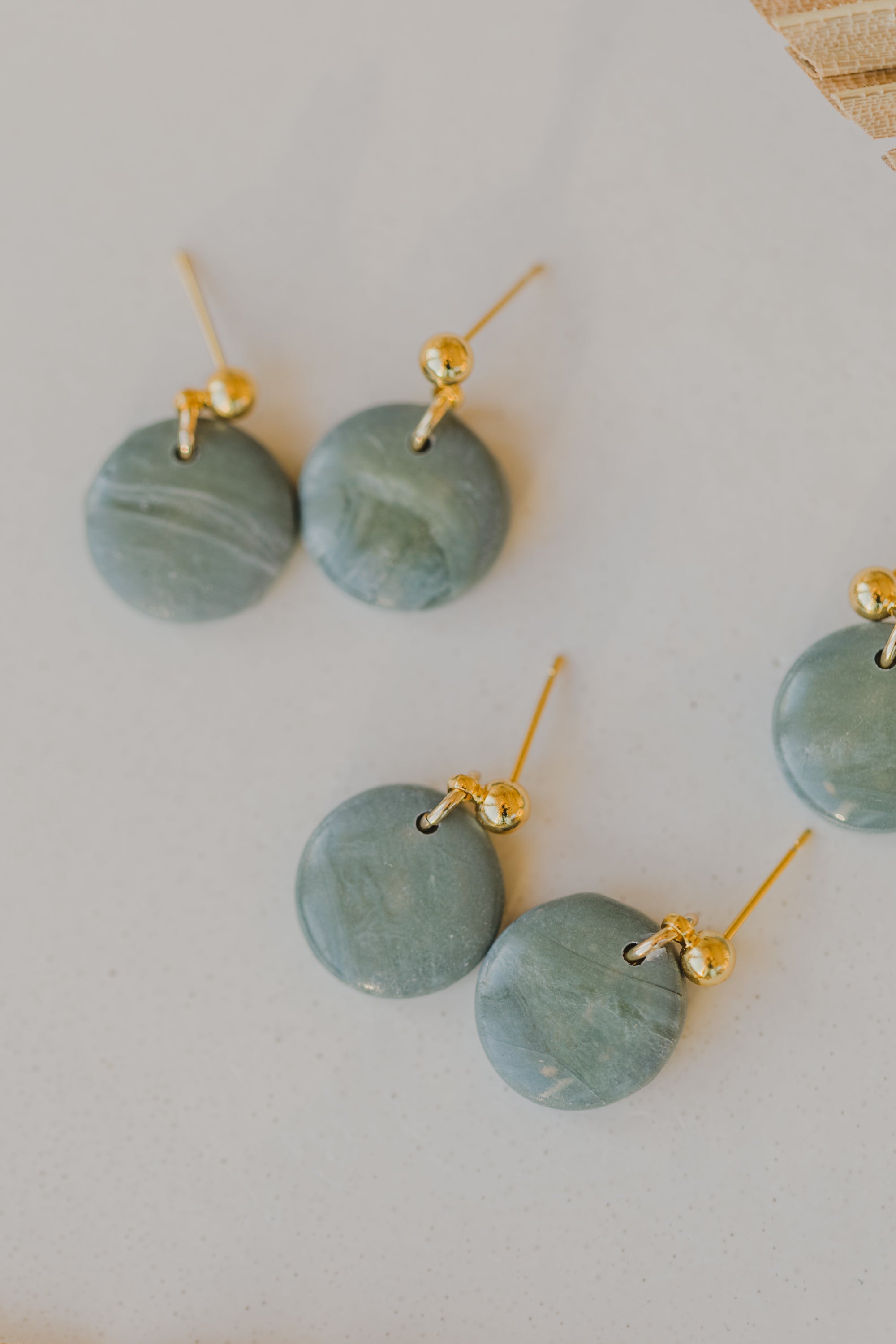 Hoop earrings with round polymer clay pendant and leaf