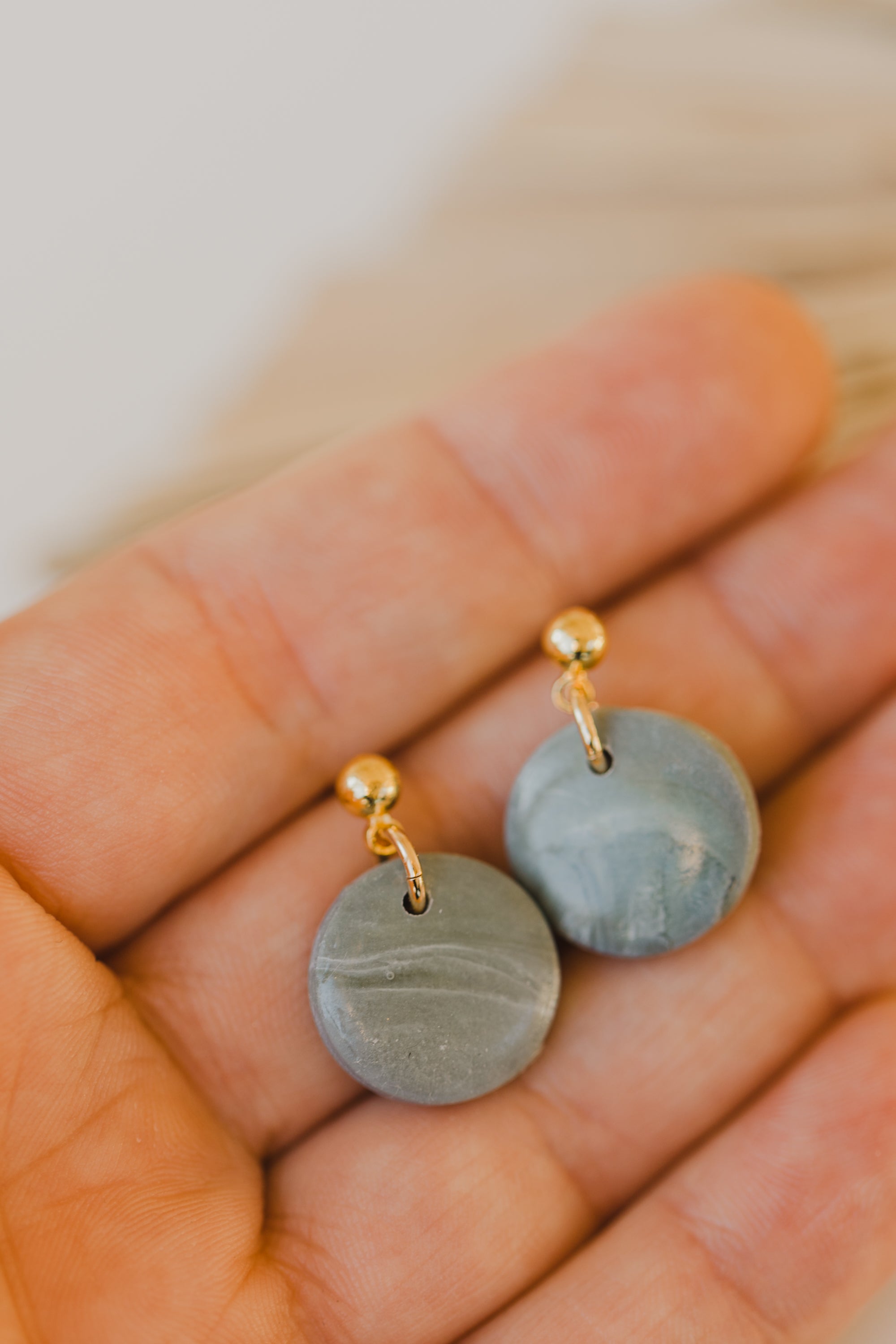 Hoop earrings with round polymer clay pendant and leaf