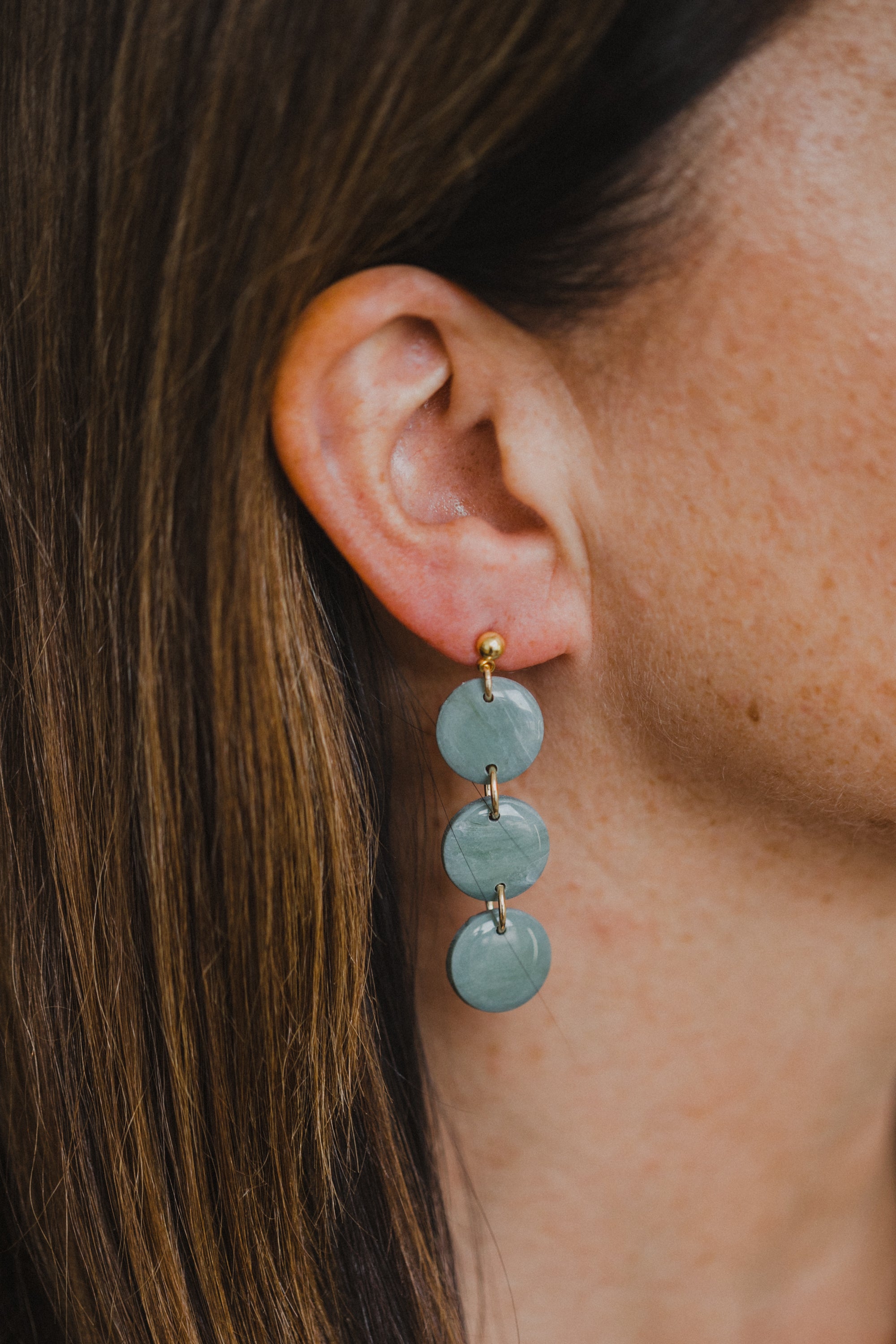 Hoop earrings with round polymer clay pendant and leaf