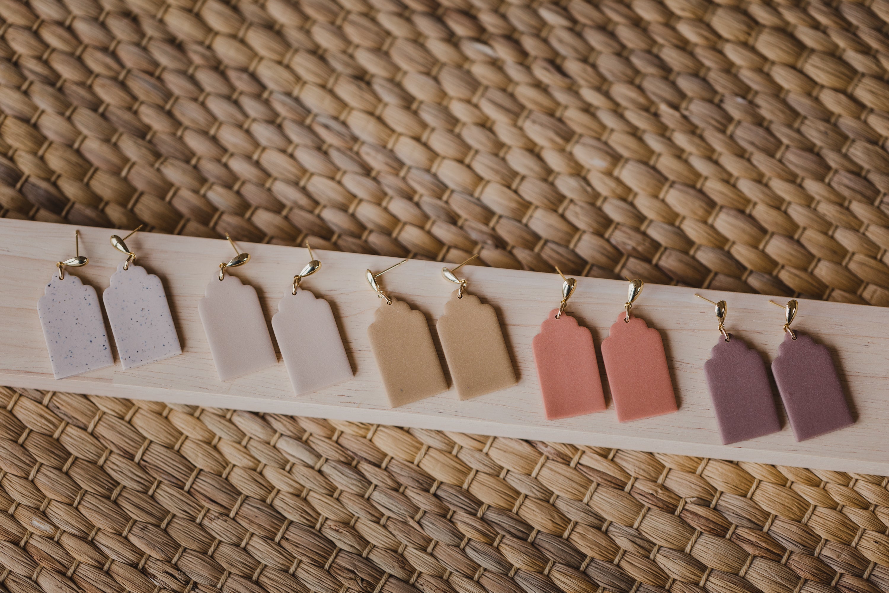 golden earrings with acrylic in white, petrol and brown