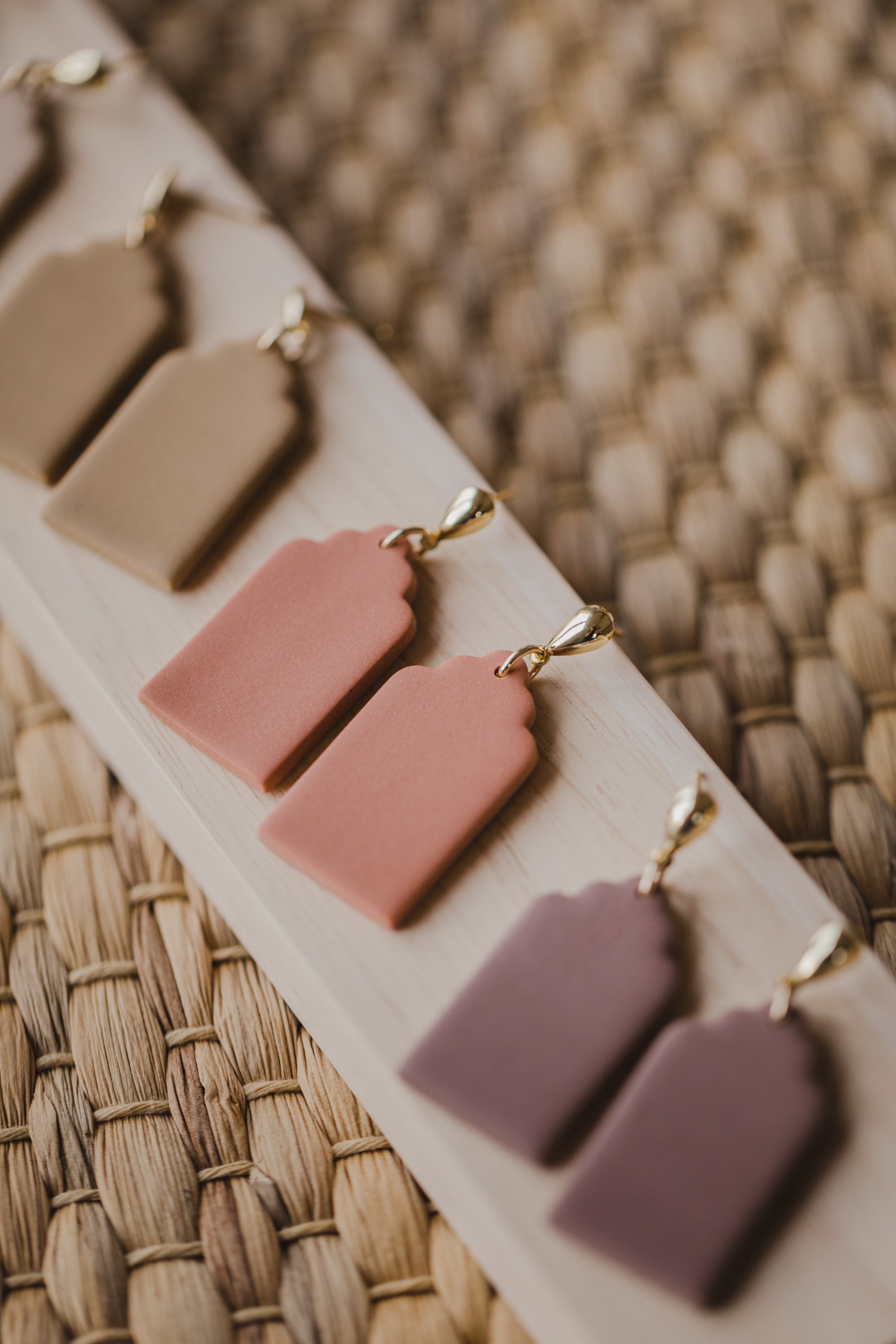 golden earrings with acrylic in white, petrol and brown