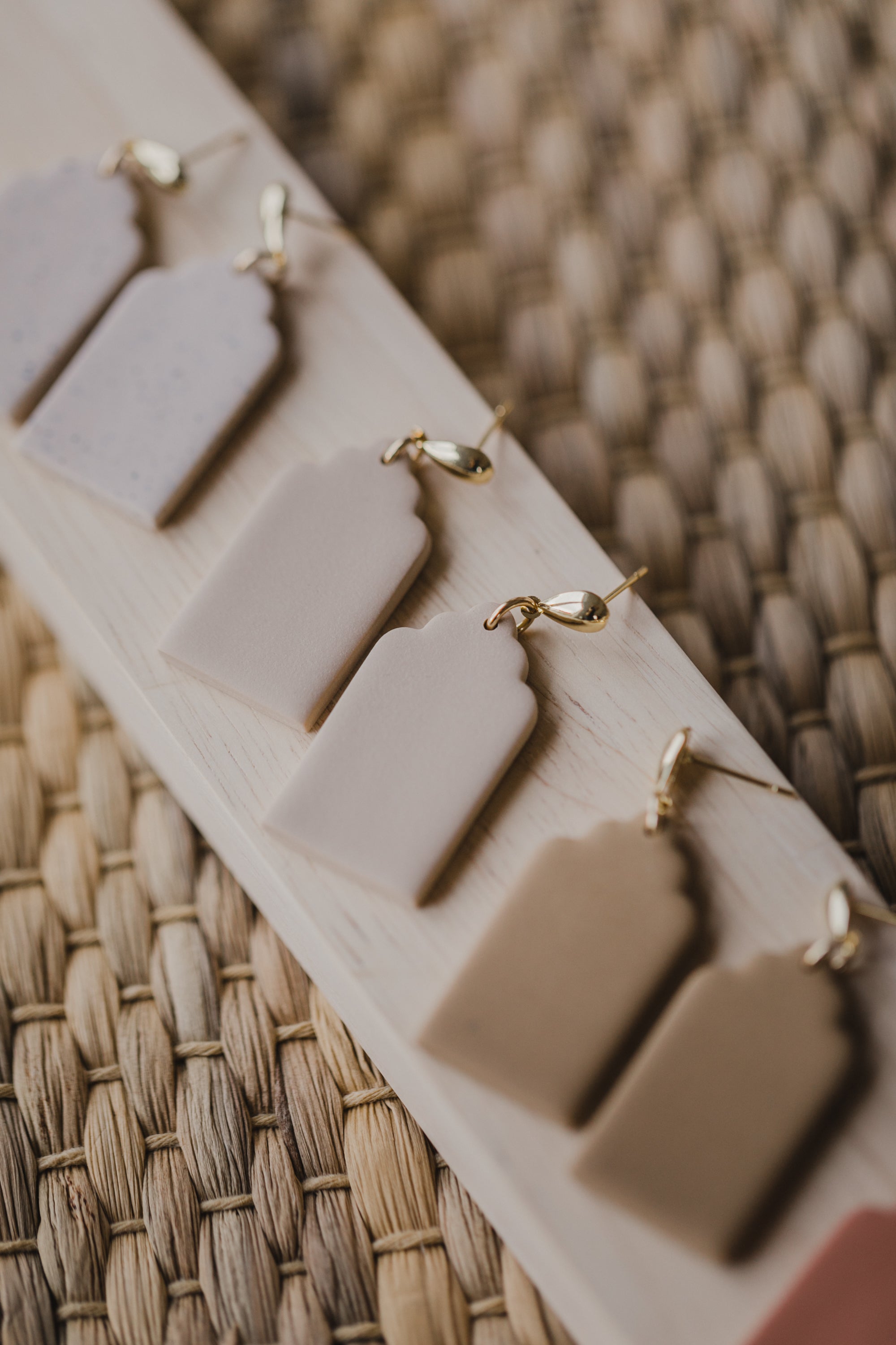 golden earrings with acrylic in white, petrol and brown