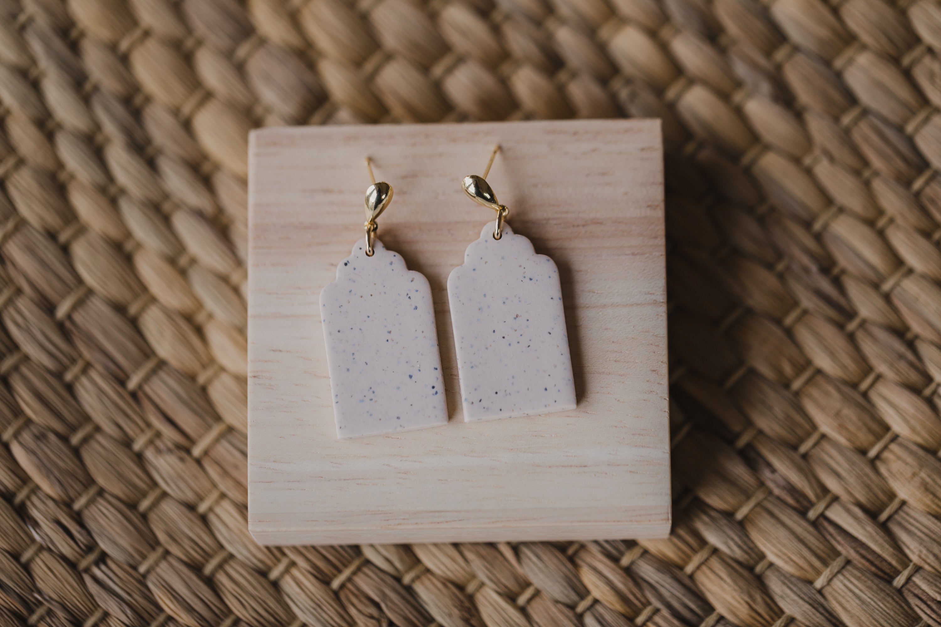 golden earrings with acrylic in white, petrol and brown