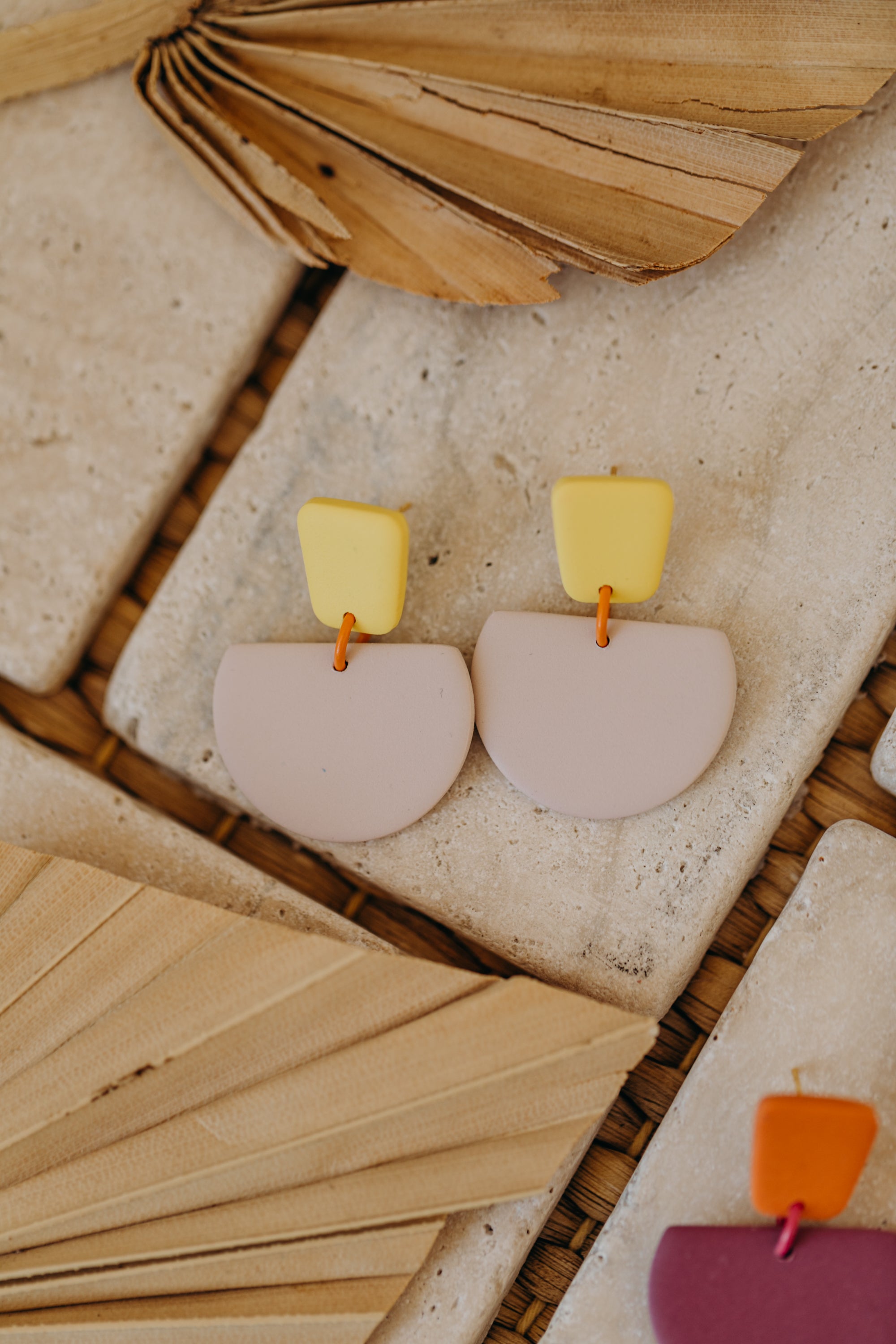 Hoop earrings with round polymer clay pendant and leaf