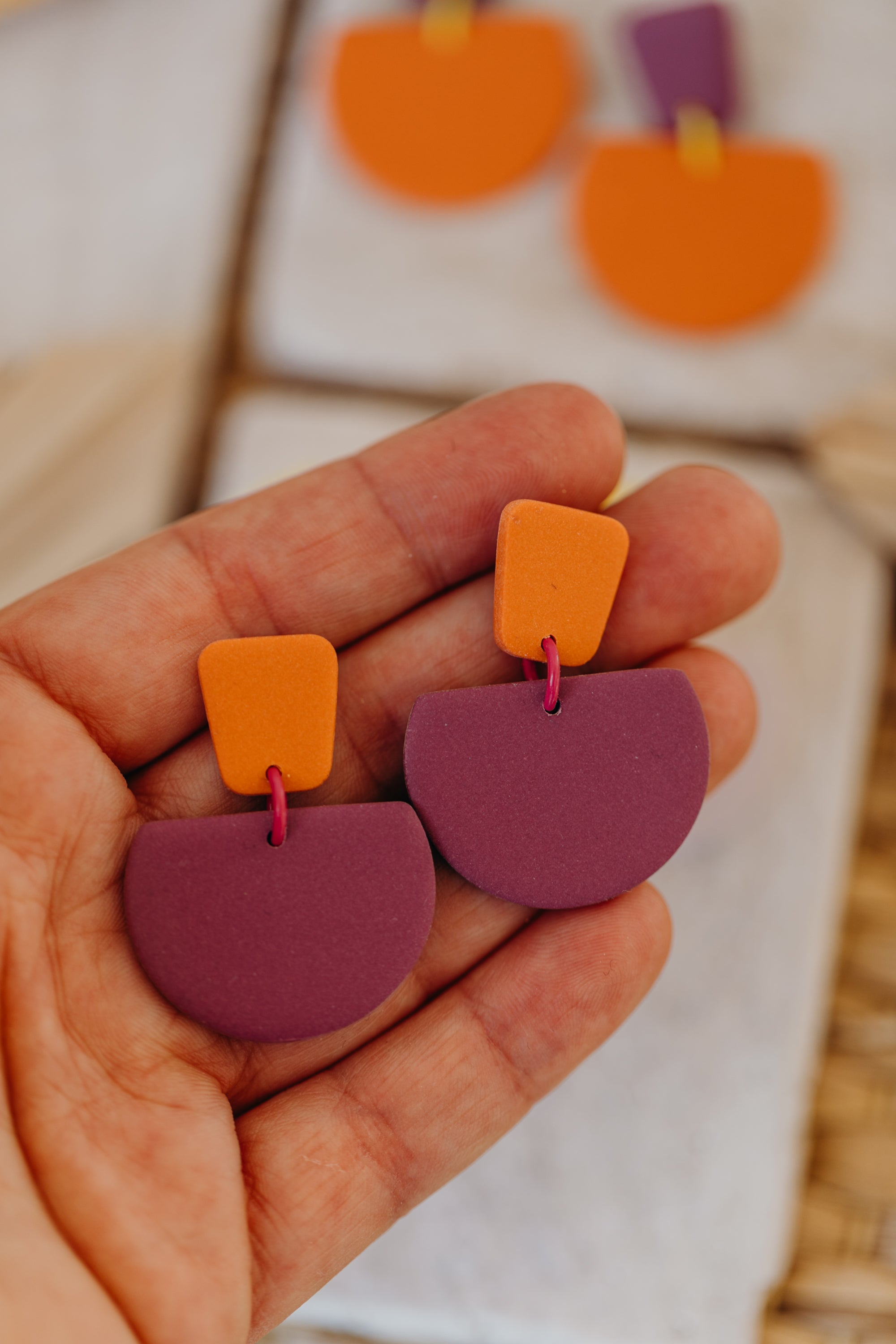 Hoop earrings with round polymer clay pendant and leaf