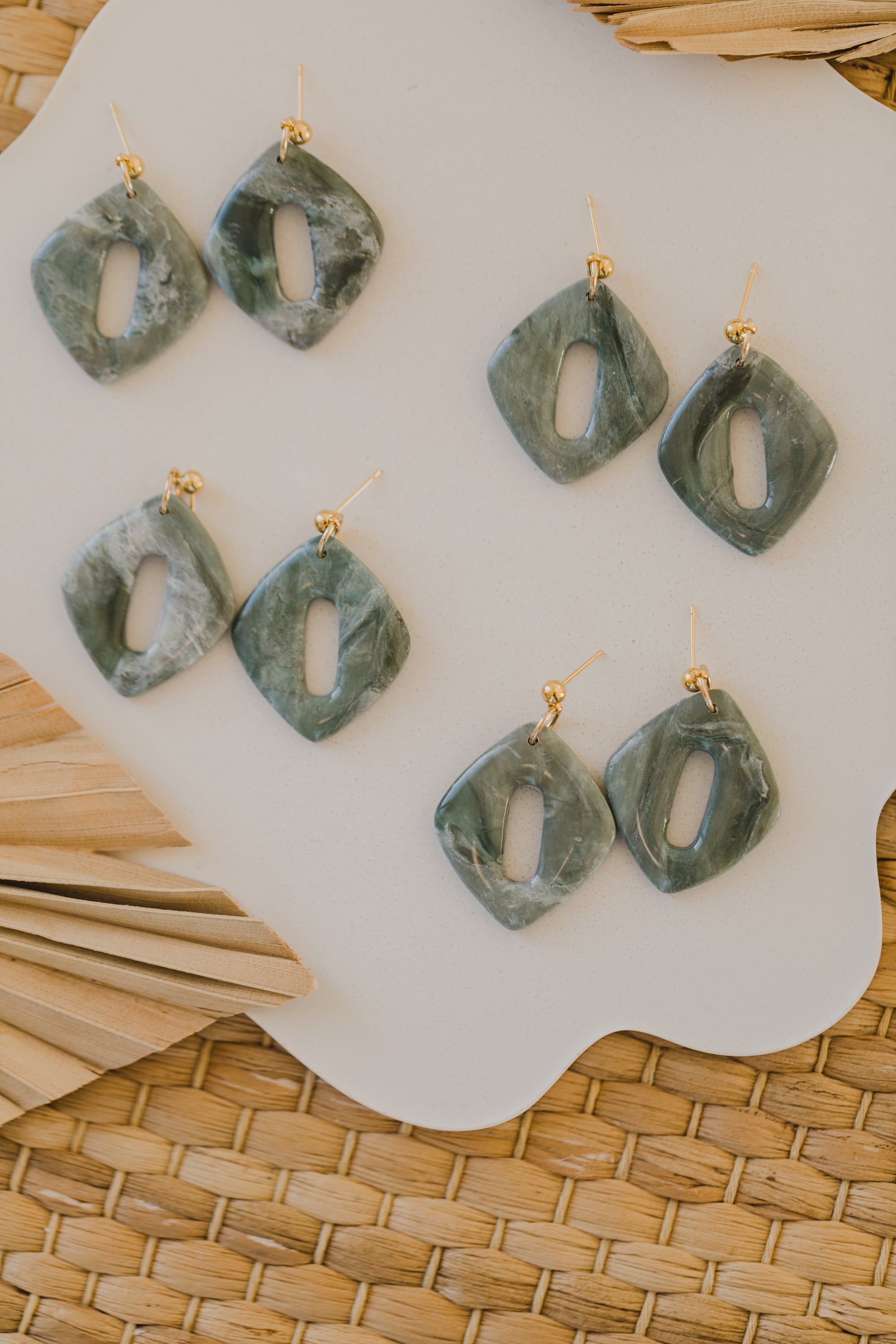 Hoop earrings with round polymer clay pendant and leaf
